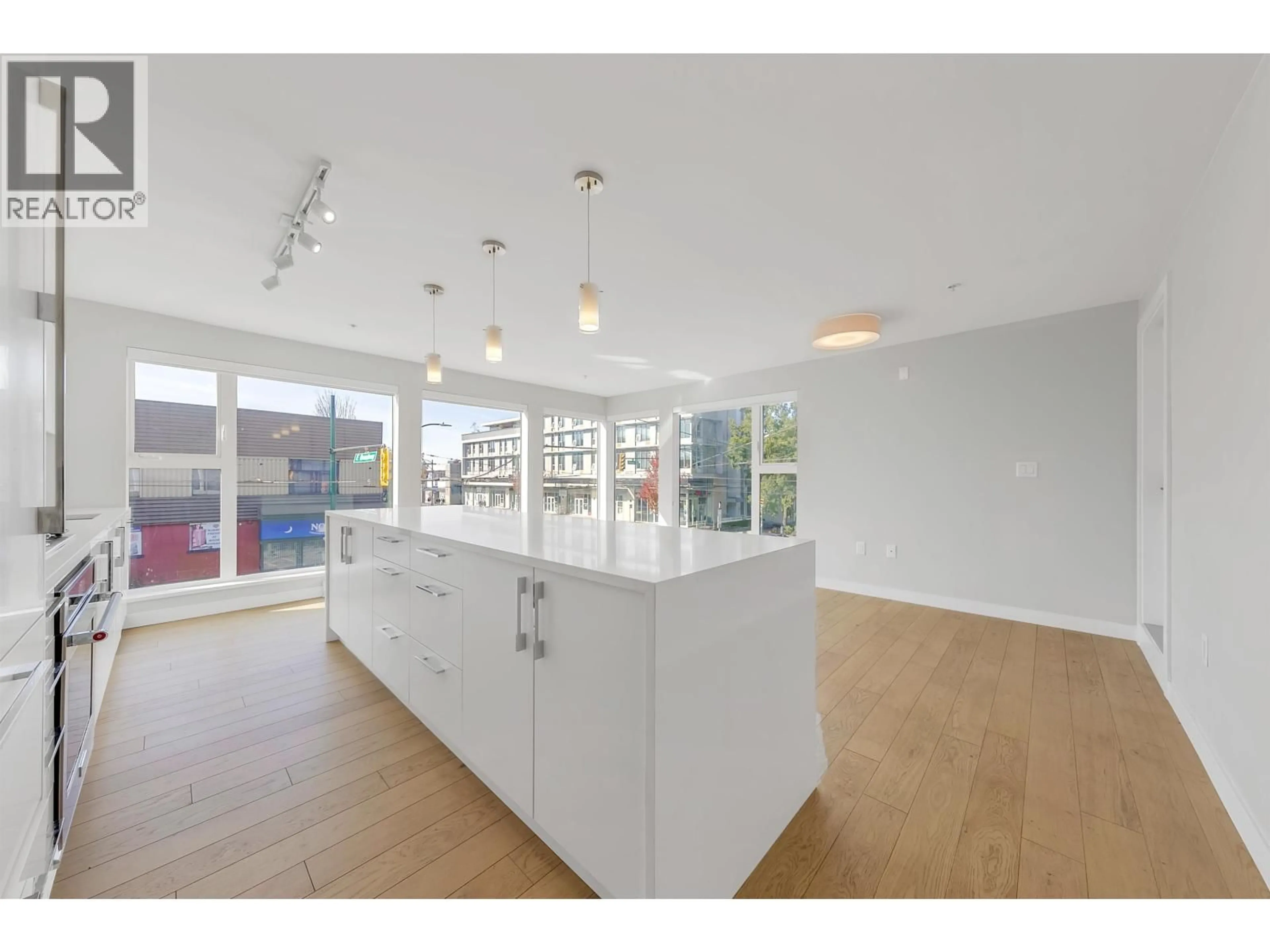Open concept kitchen, unknown for 202 - 2508 FRASER STREET, Vancouver British Columbia V5T3V4
