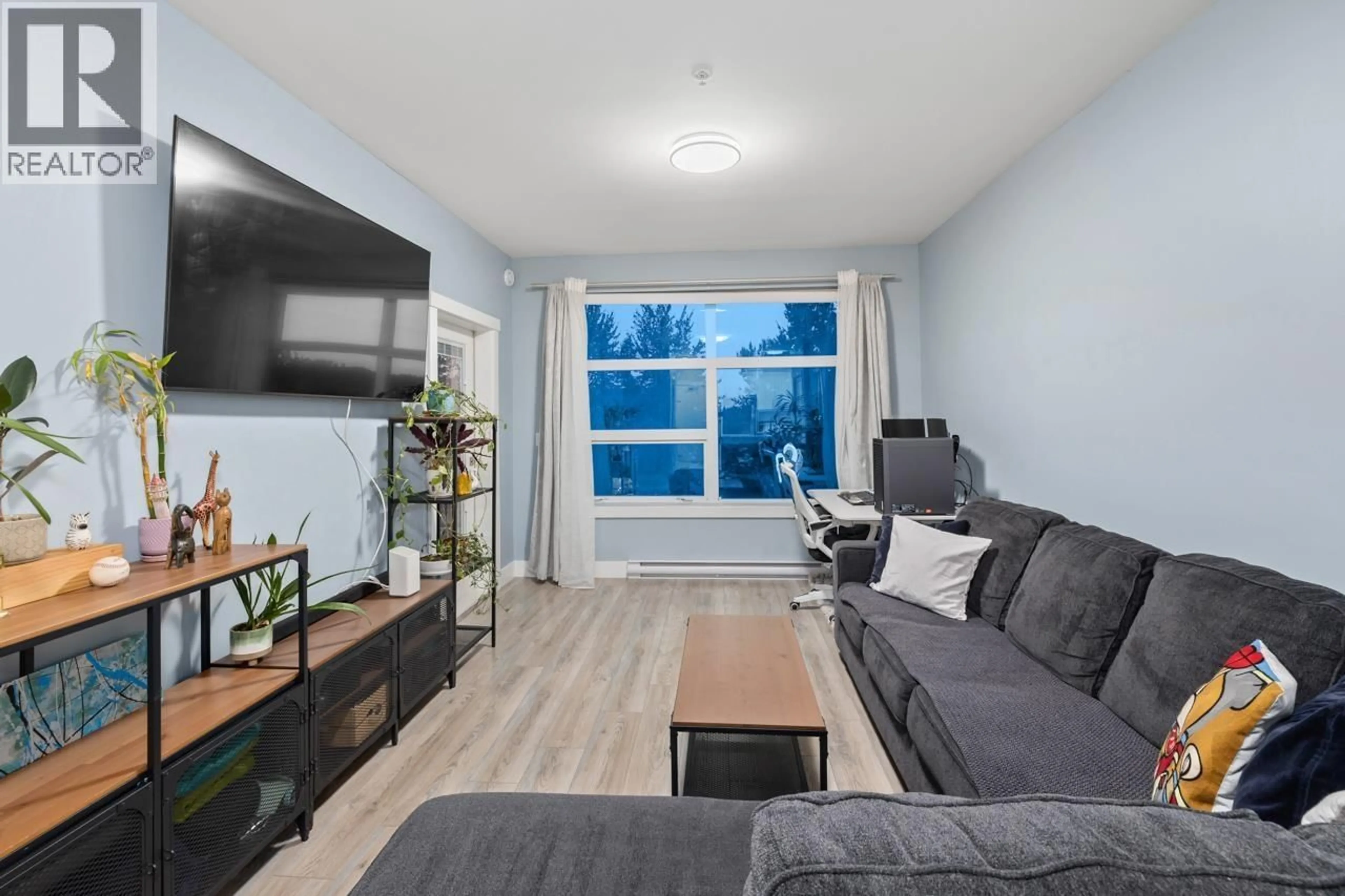 Living room with furniture, wood/laminate floor for 306 - 22577 ROYAL CRESCENT, Maple Ridge British Columbia V2X2M2