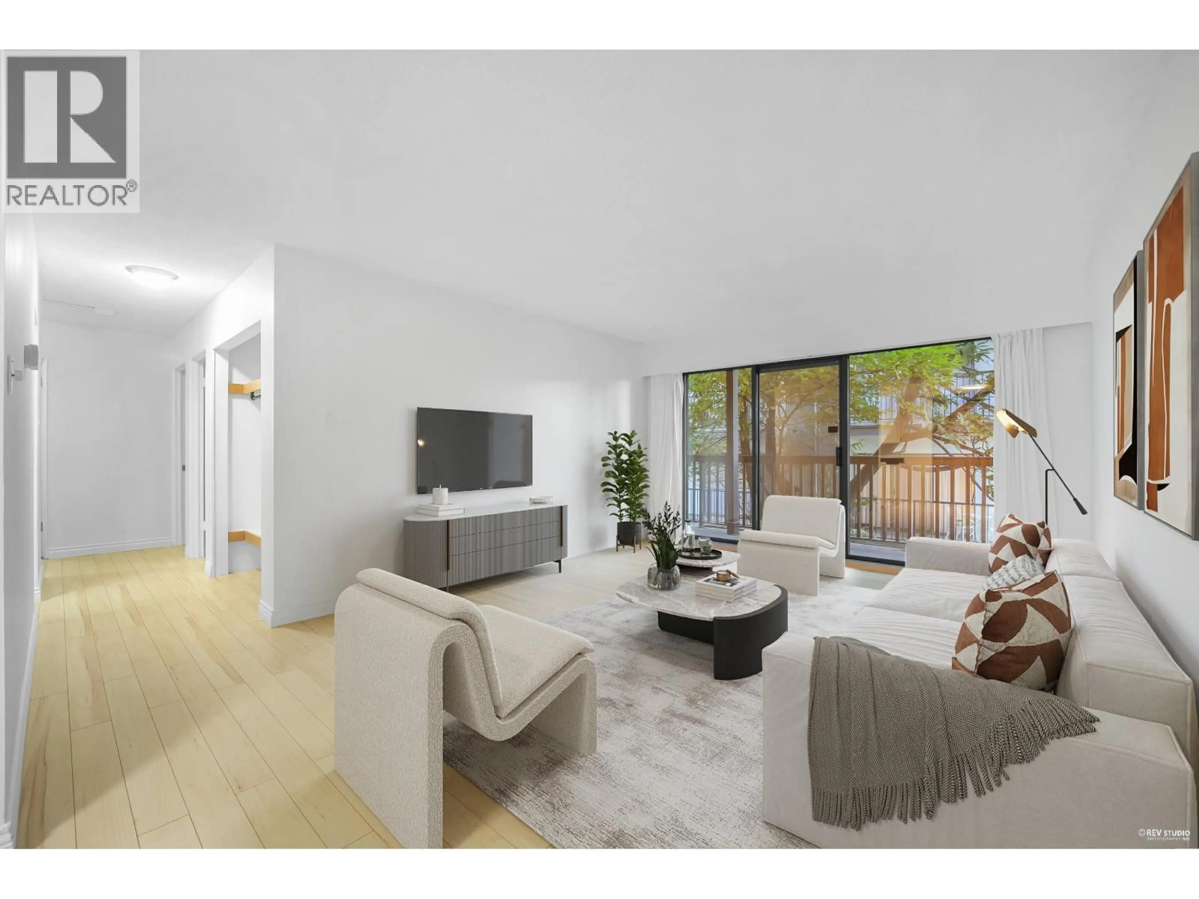 Living room with furniture, wood/laminate floor for 103 - 150 5TH STREET, North Vancouver British Columbia V7L1L5