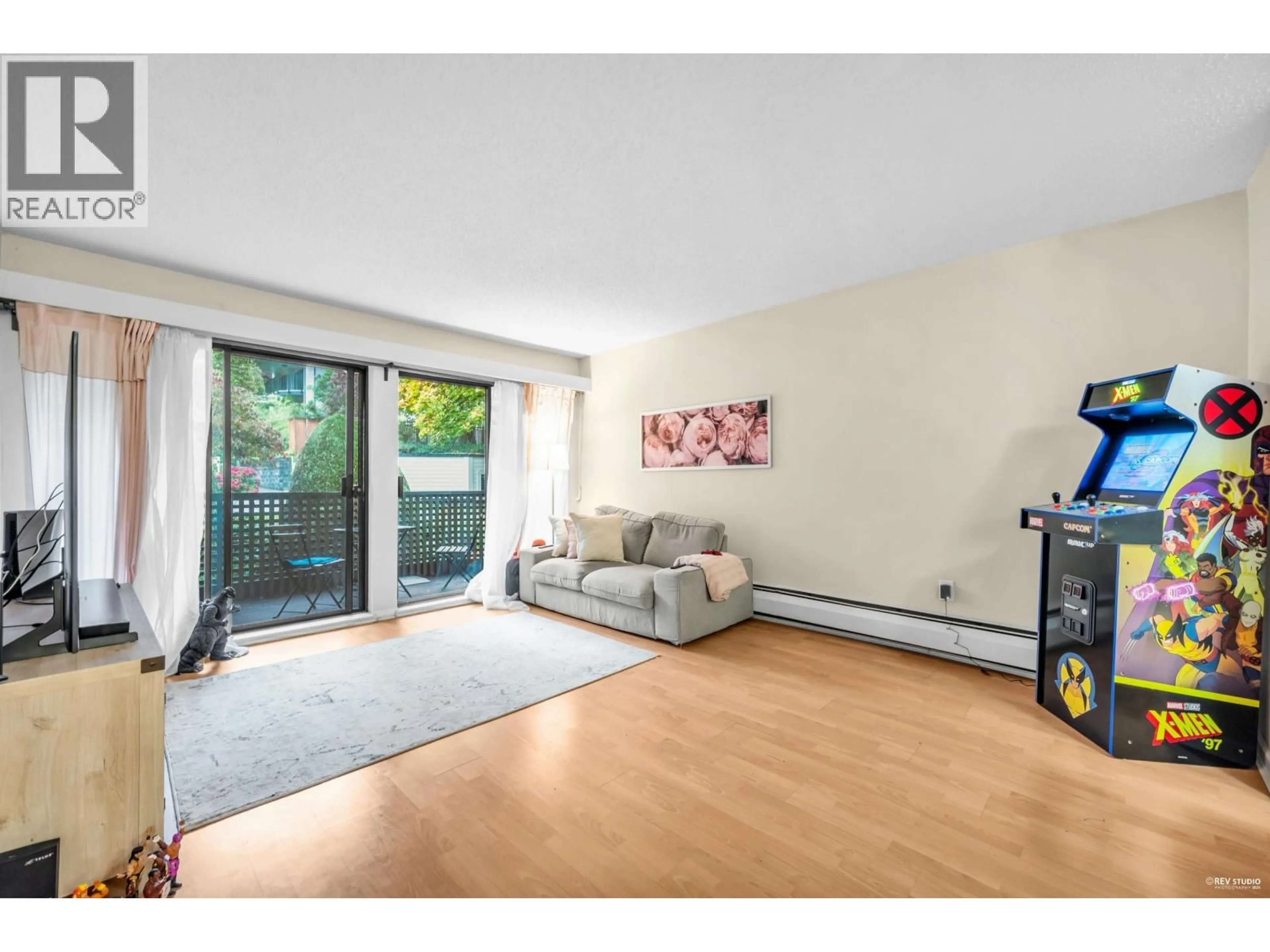 Living room with furniture, wood/laminate floor for 208 - 1955 WOODWAY PLACE, Burnaby British Columbia V5B4S5