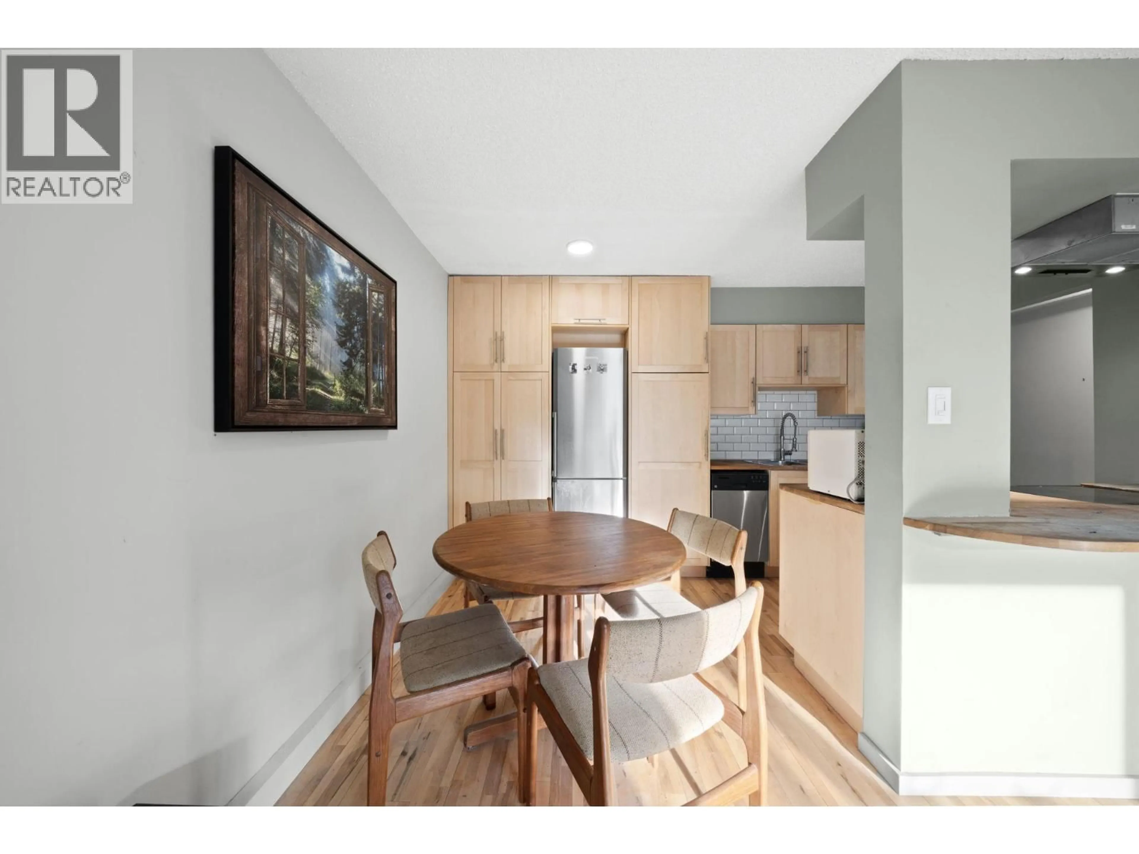 Open concept kitchen, wood/laminate floor for 104 - 1549 KITCHENER STREET, Vancouver British Columbia V5L2V8