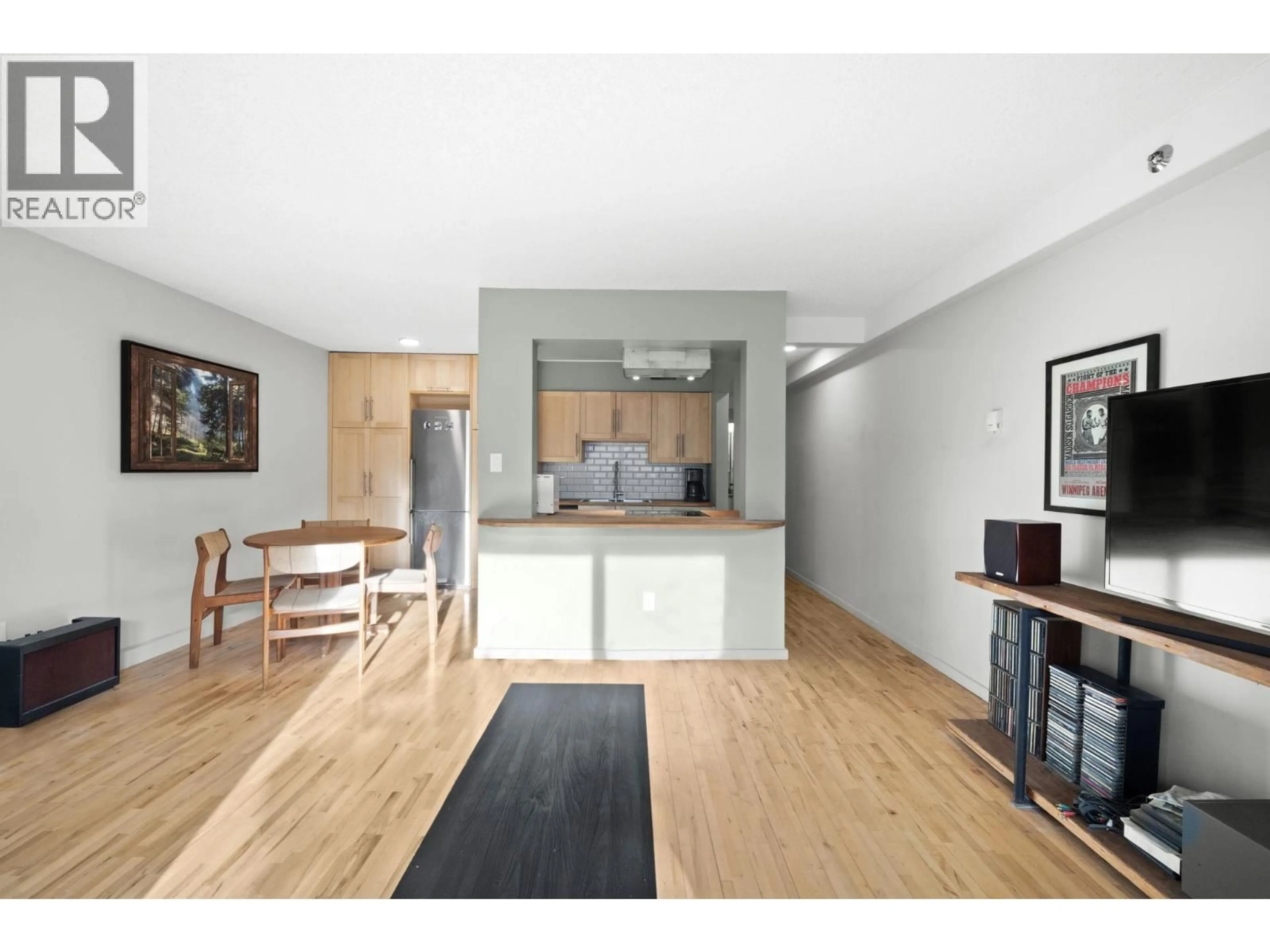 Open concept kitchen, wood/laminate floor for 104 - 1549 KITCHENER STREET, Vancouver British Columbia V5L2V8
