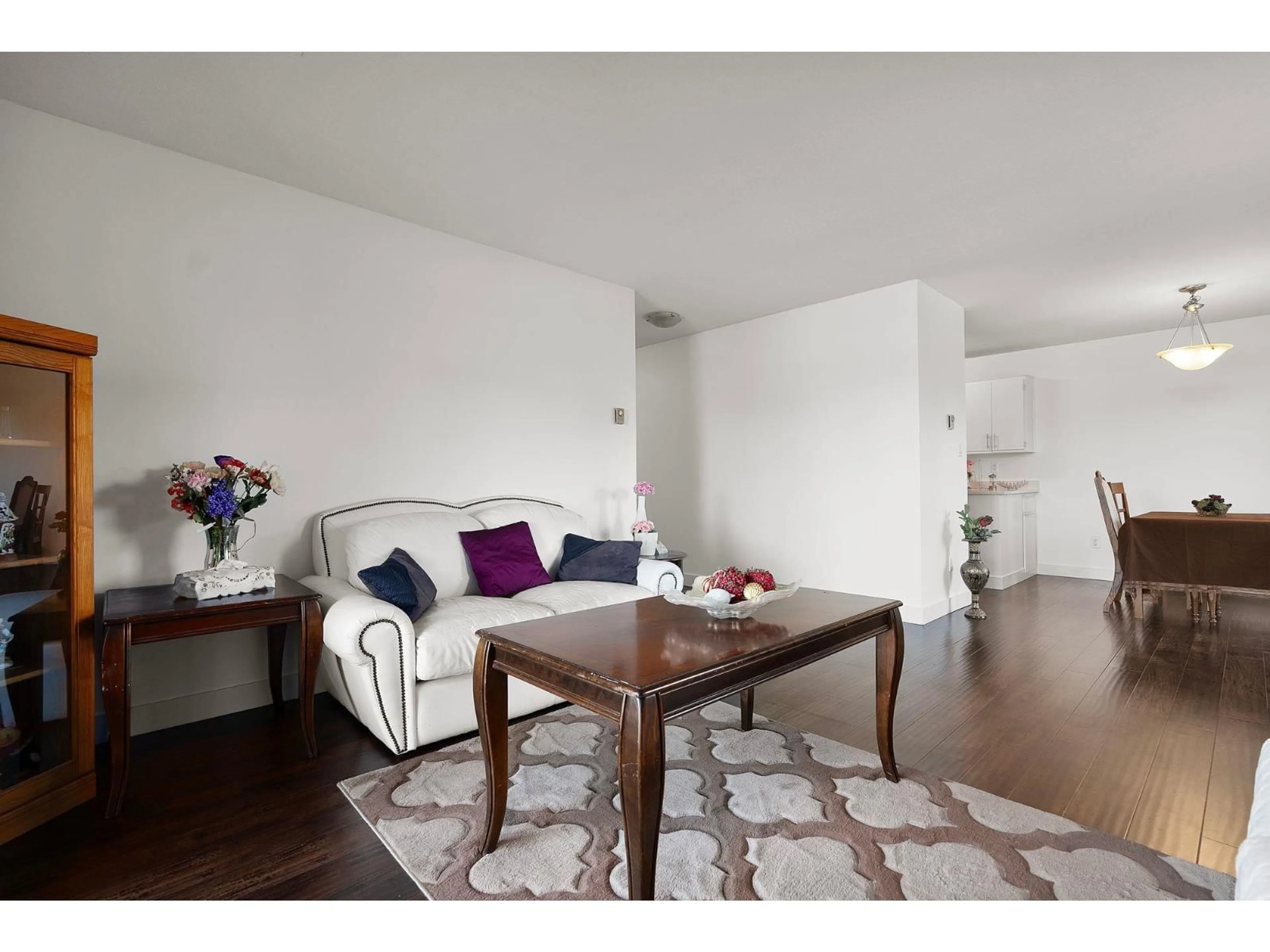 Living room with furniture, wood/laminate floor for 213 - 2750 FULLER STREET, Abbotsford British Columbia V2S3K1