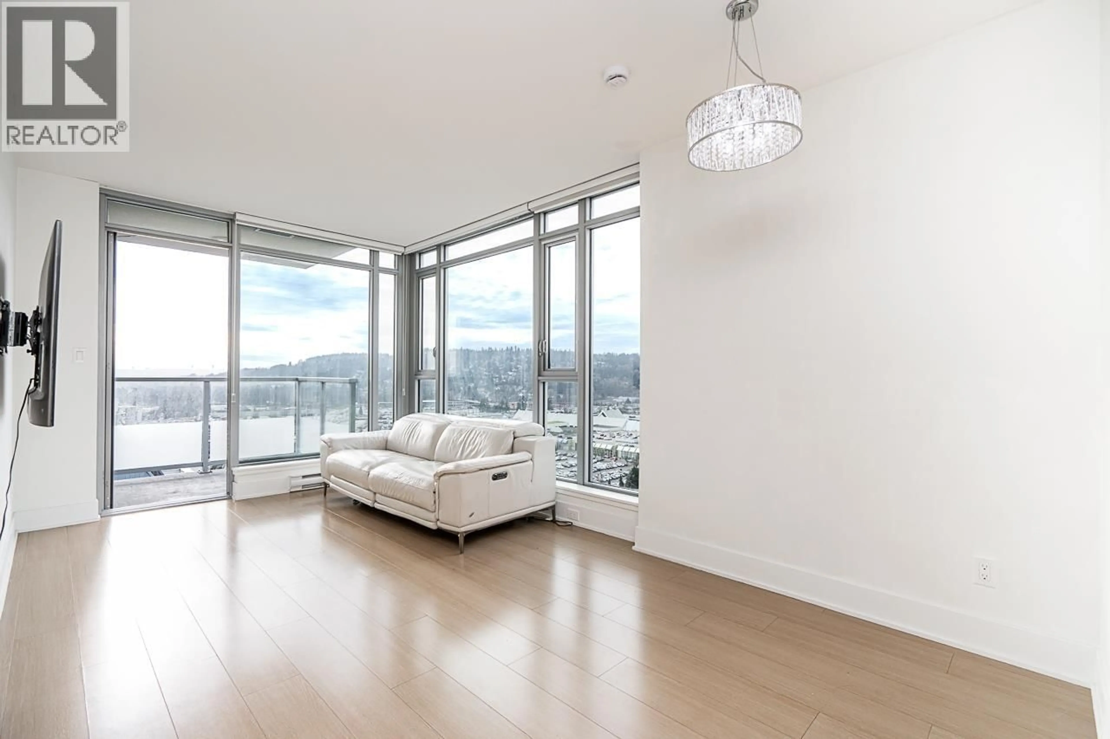 Living room with furniture, wood/laminate floor for 2002 - 1188 PINETREE WAY, Coquitlam British Columbia V3B0K9