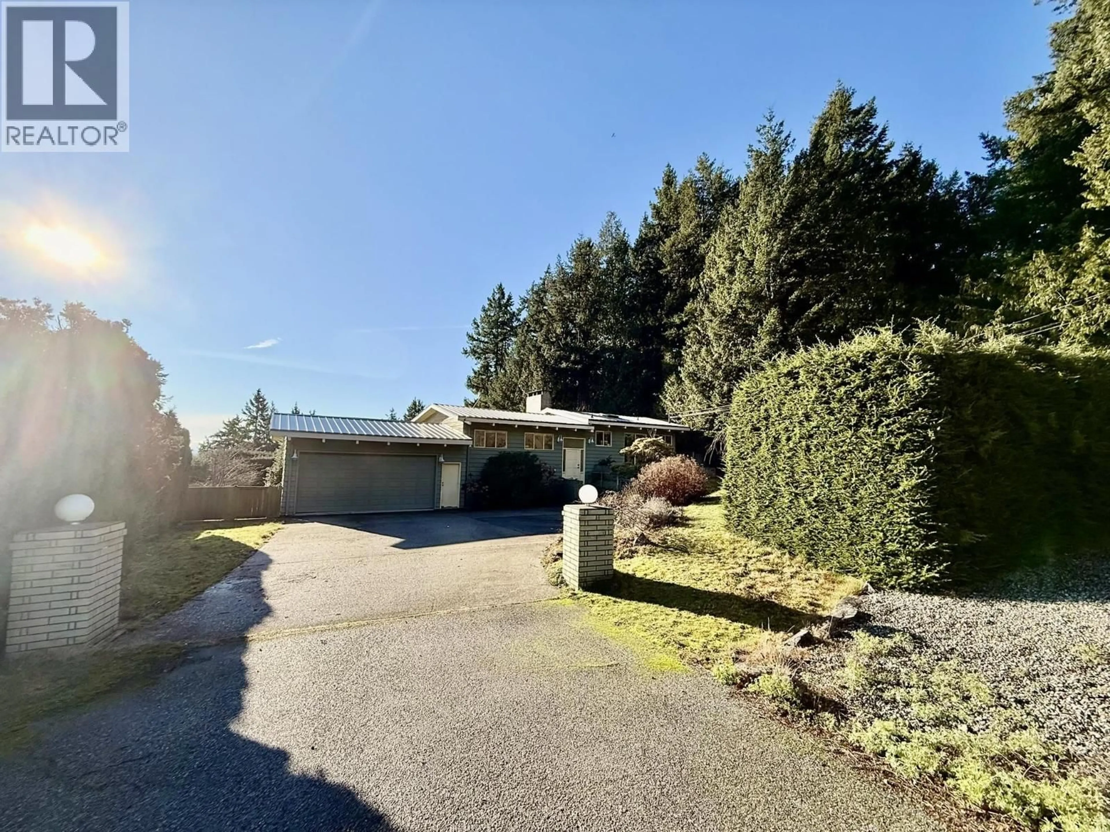 A pic from outside/outdoor area/front of a property/back of a property/a pic from drone, street for 7077 DALE ROAD, Sechelt British Columbia V7Z0N2