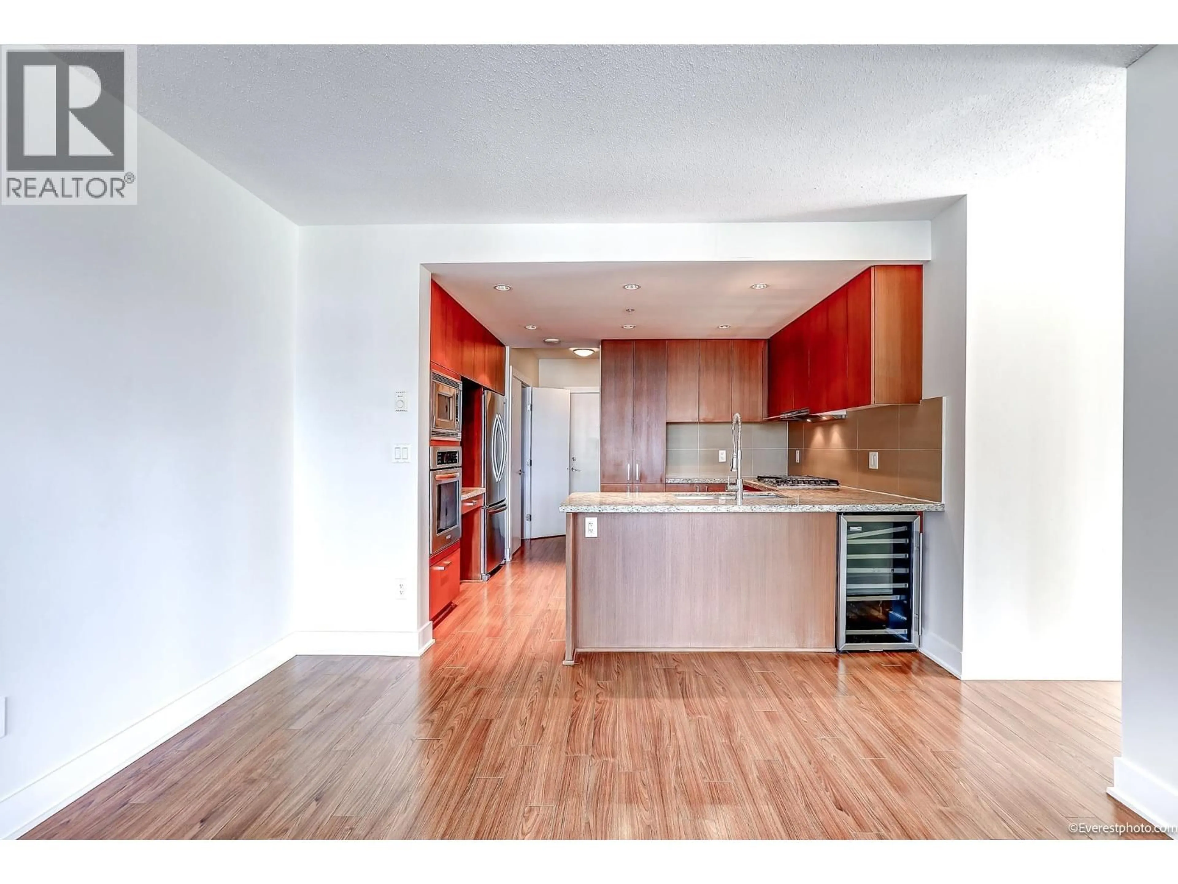 Open concept kitchen, wood/laminate floor for 1502 - 1155 THE HIGH STREET, Coquitlam British Columbia V3B7W4