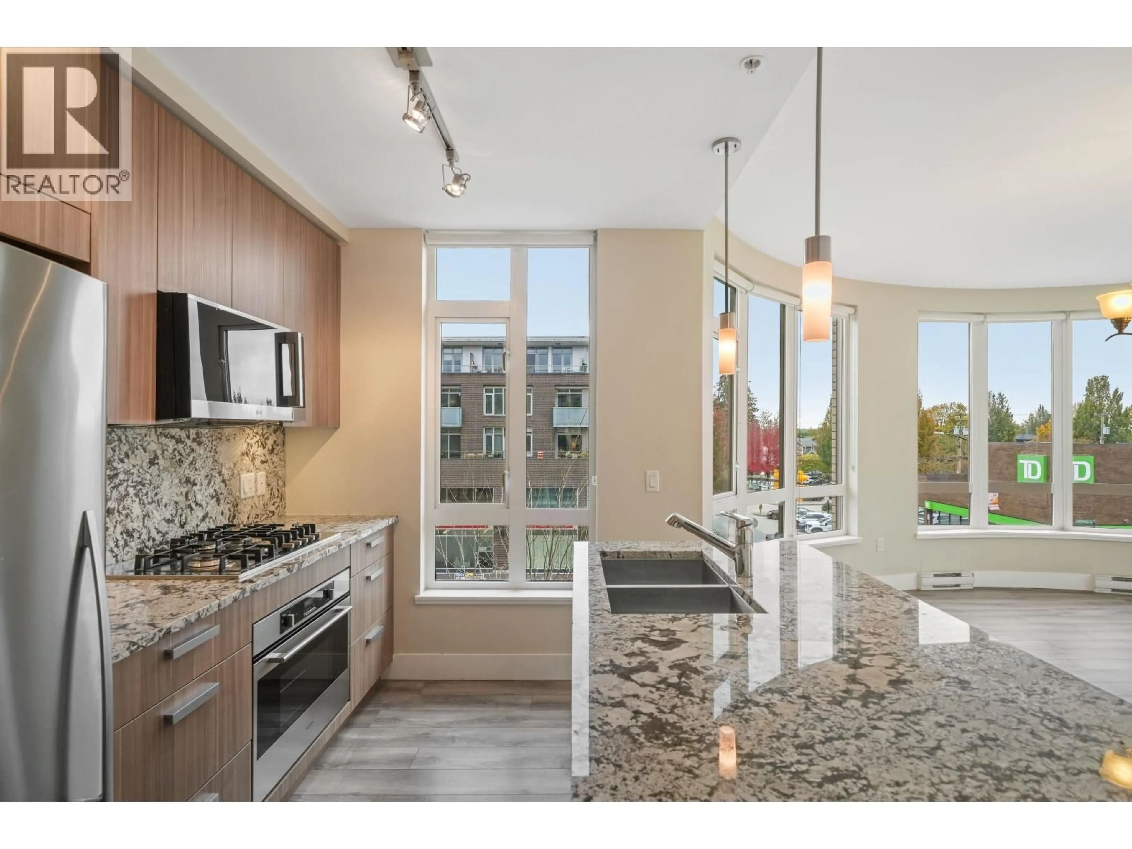 Open concept kitchen, ceramic/tile floor for 306 - 4307 HASTINGS STREET, Burnaby British Columbia V5C2J7