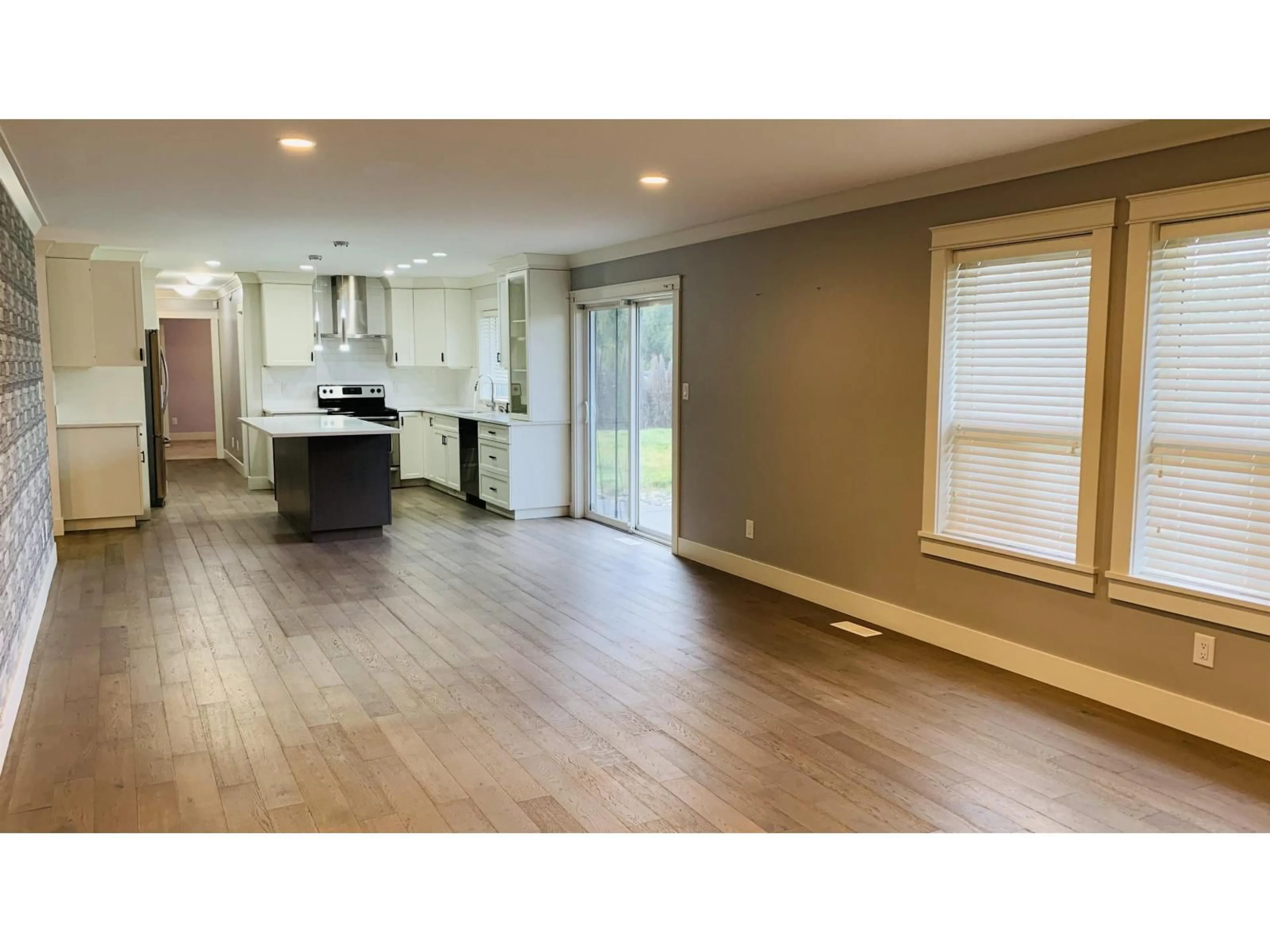 Open concept kitchen, wood/laminate floor for 20737 24 AVENUE, Langley British Columbia V2Z2B4