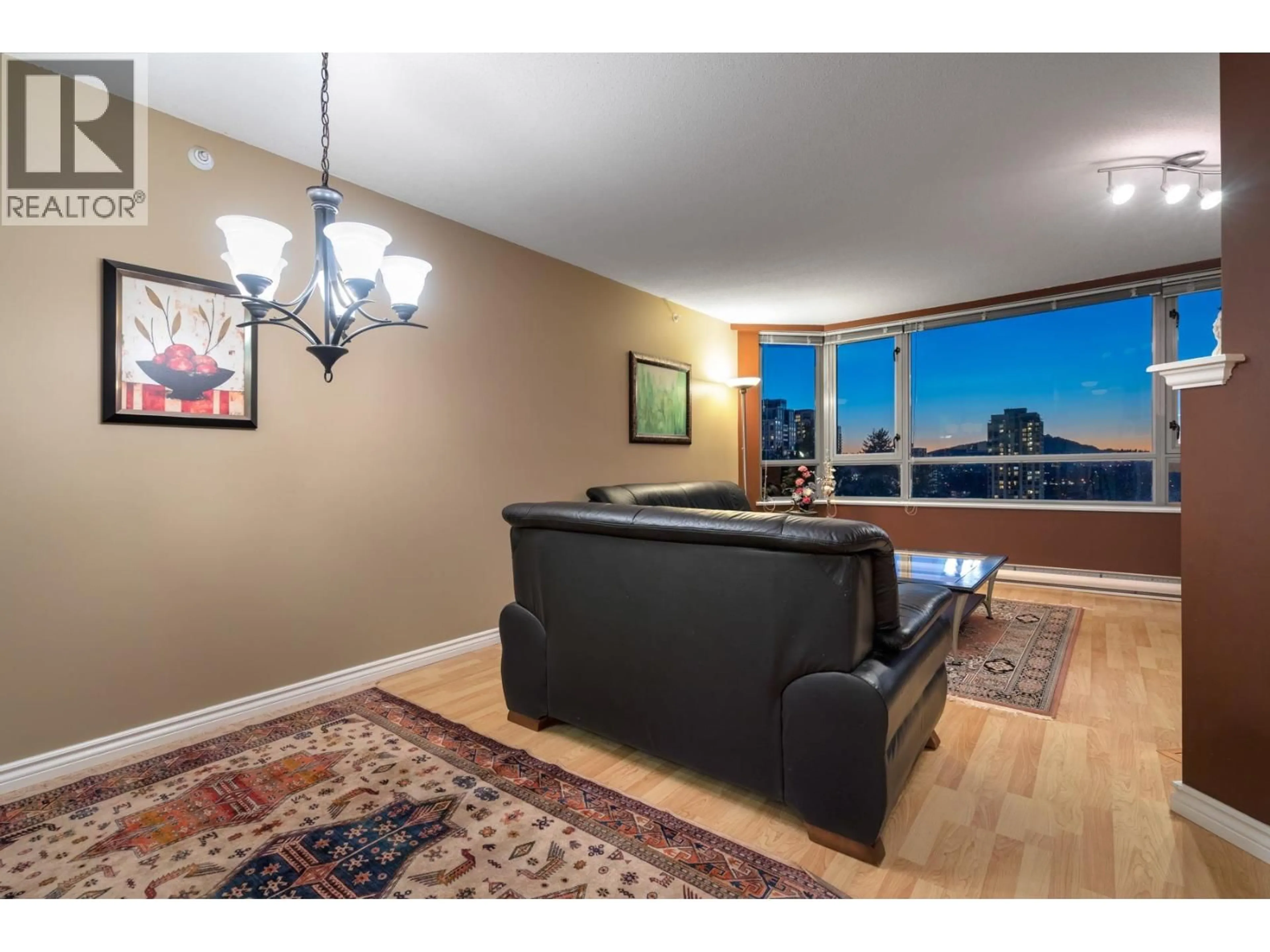 Living room with furniture, wood/laminate floor for 1502 - 3070 GUILDFORD WAY, Coquitlam British Columbia V3B7R8