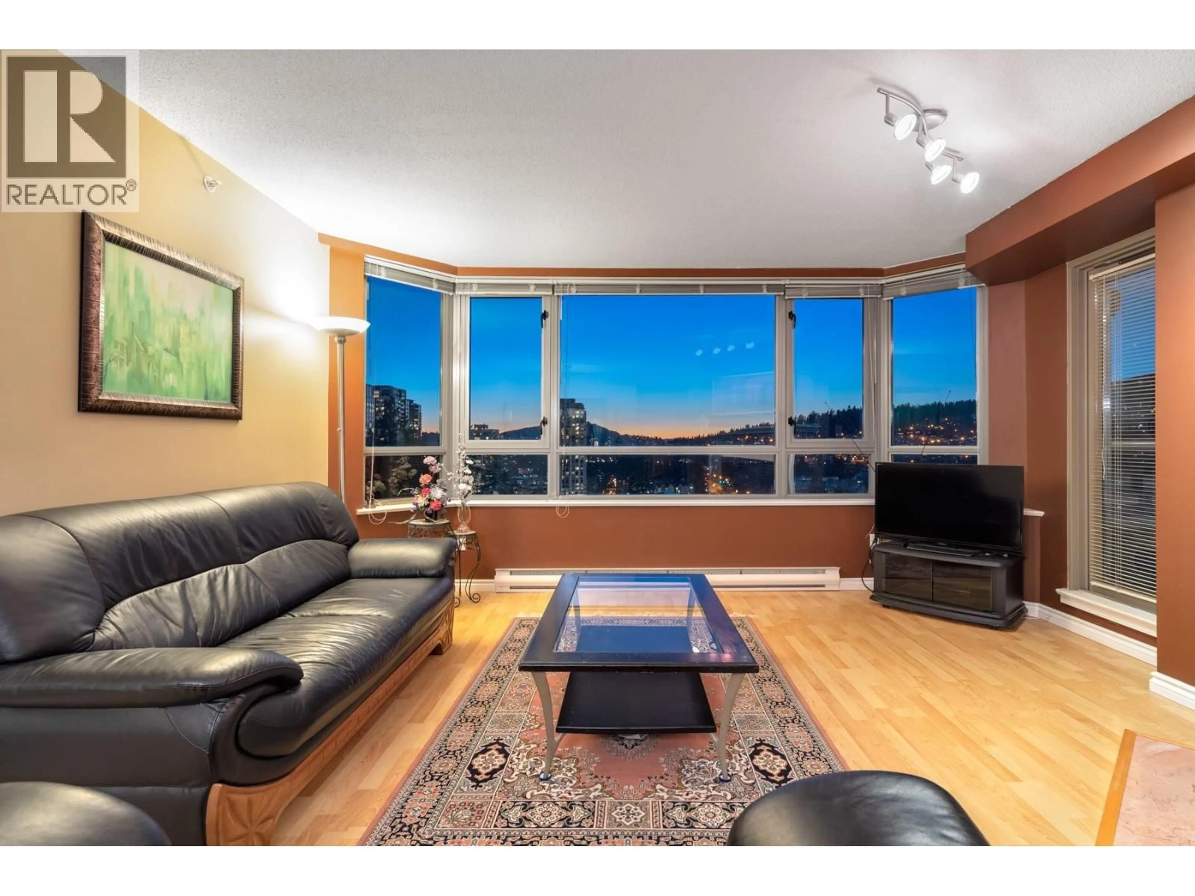 Living room with furniture, wood/laminate floor for 1502 - 3070 GUILDFORD WAY, Coquitlam British Columbia V3B7R8
