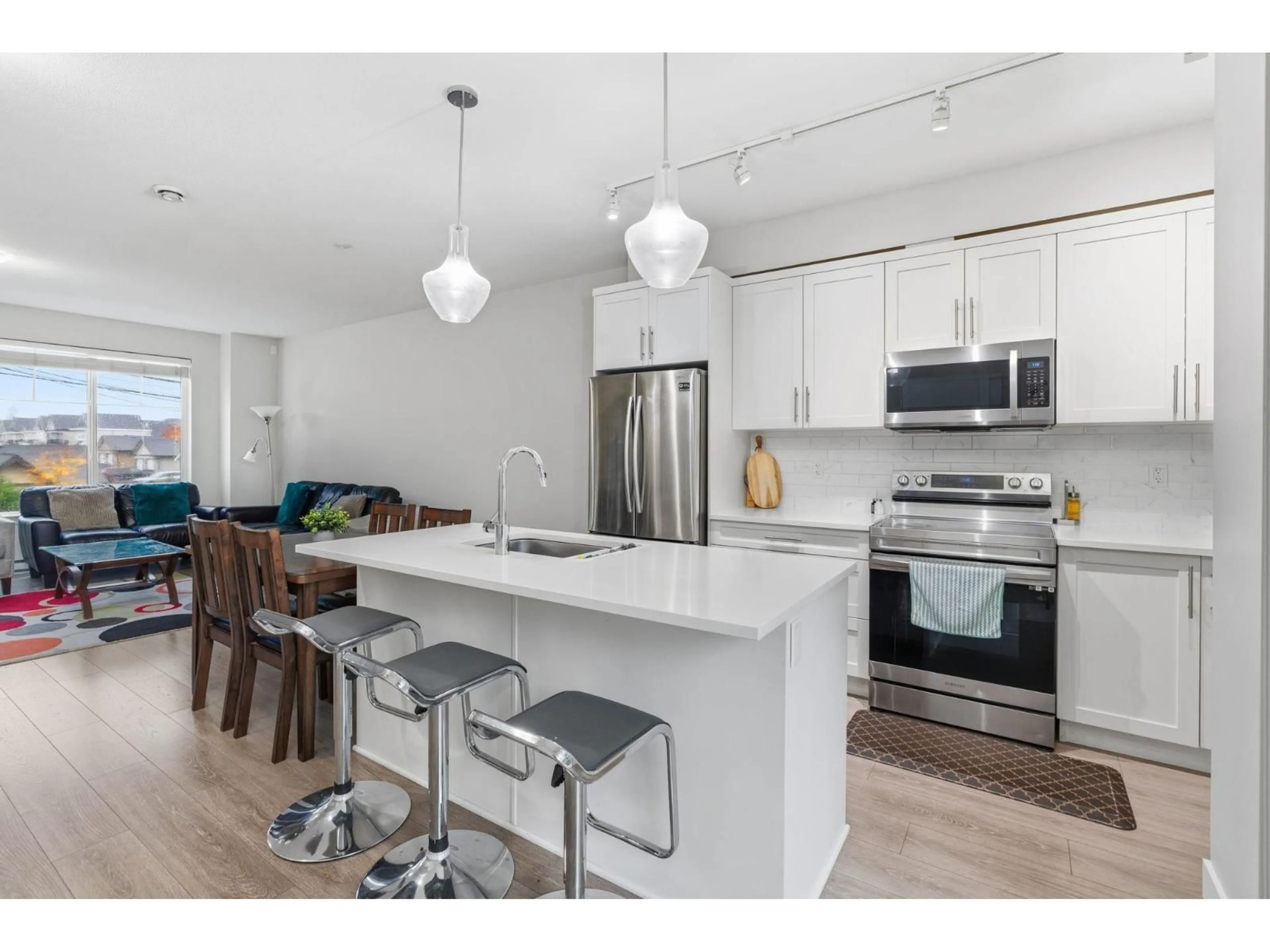 Open concept kitchen, wood/laminate floor for 147 - 6030 142 STREET, Surrey British Columbia V3X0J5