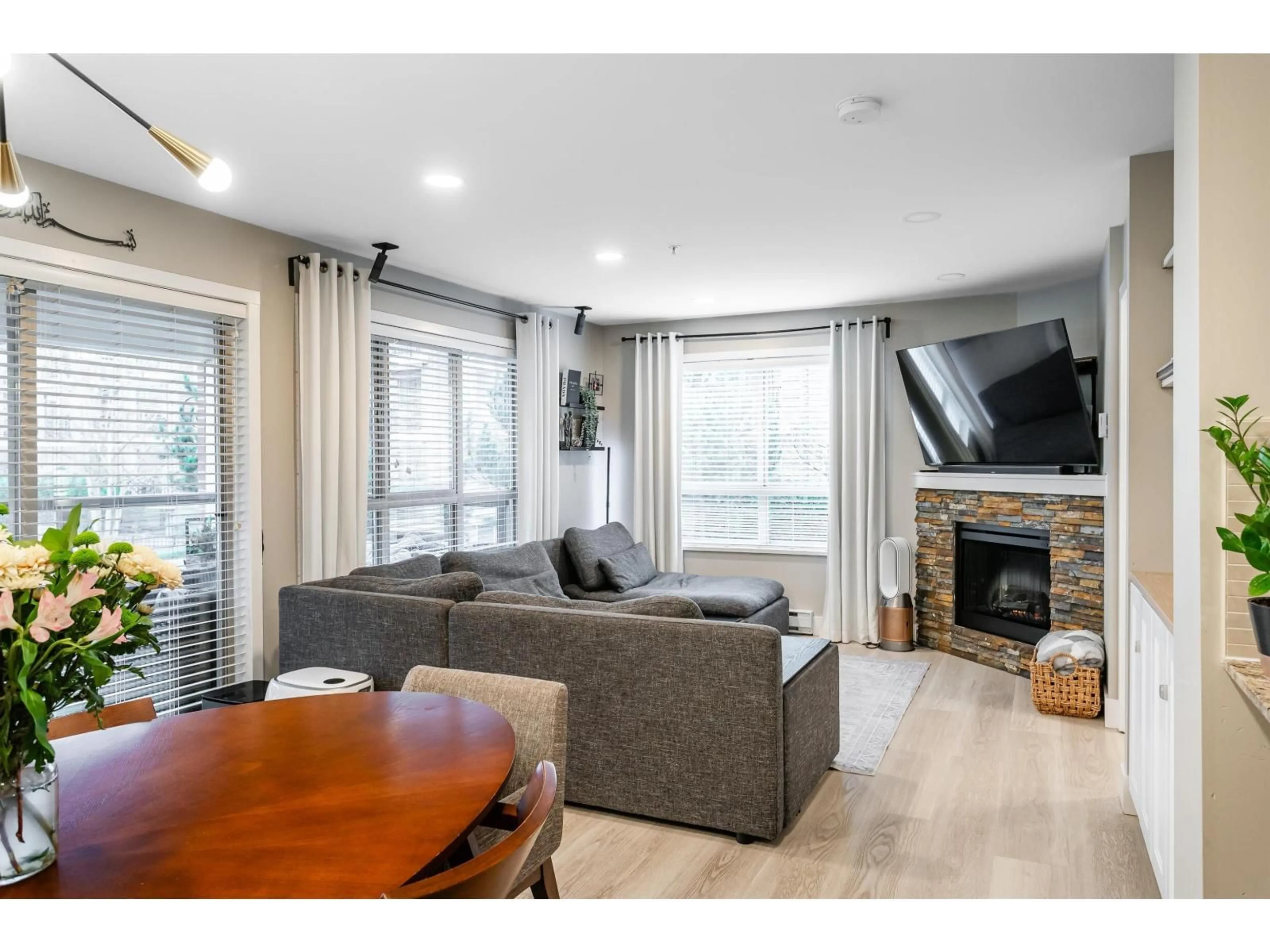 Living room with furniture, wood/laminate floor for A206 - 8929 202 STREET, Langley British Columbia V1M0B4