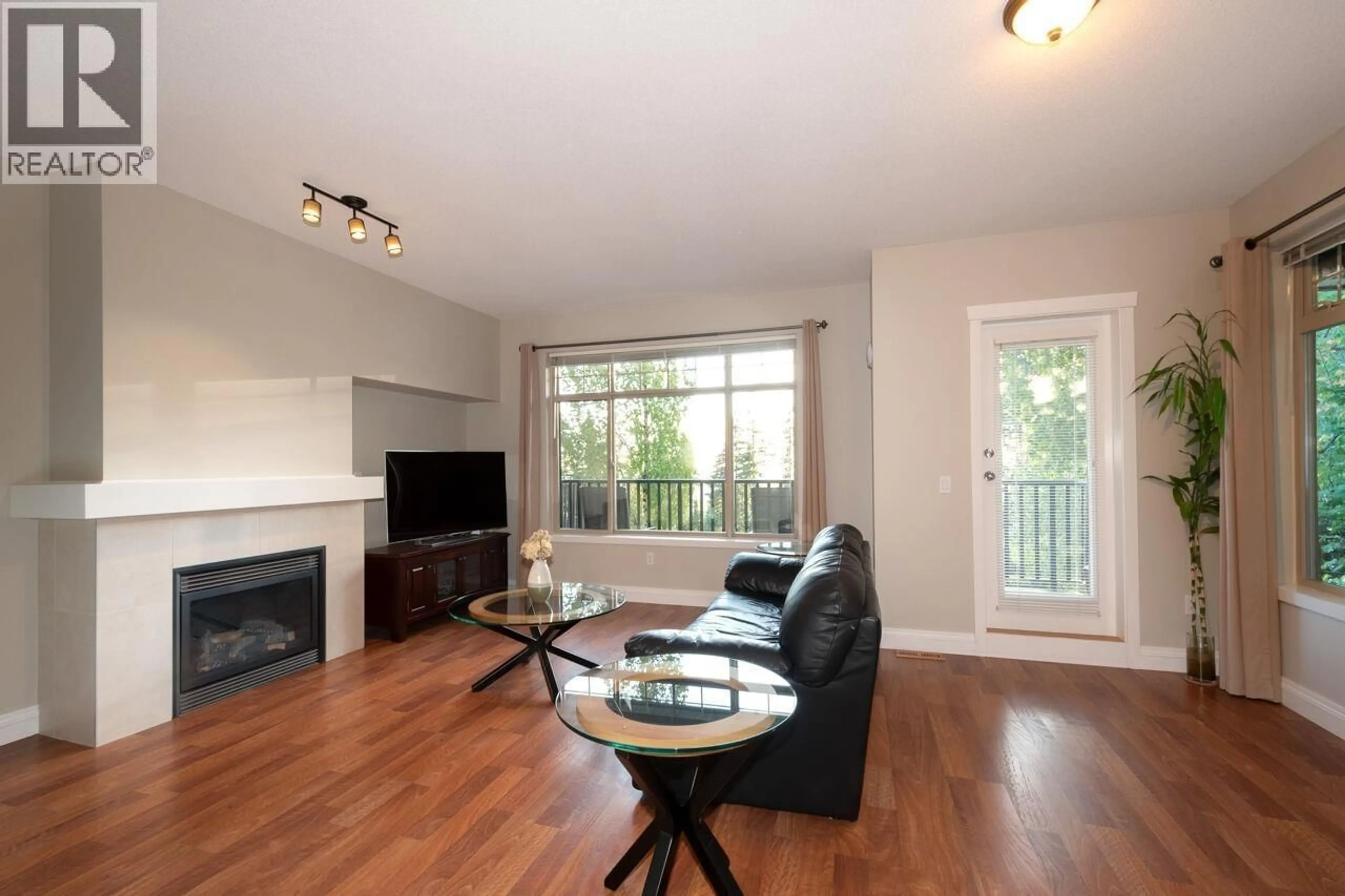 Living room with furniture, wood/laminate floor for 95 - 55 HAWTHORN DRIVE, Port Moody British Columbia V3H0B3