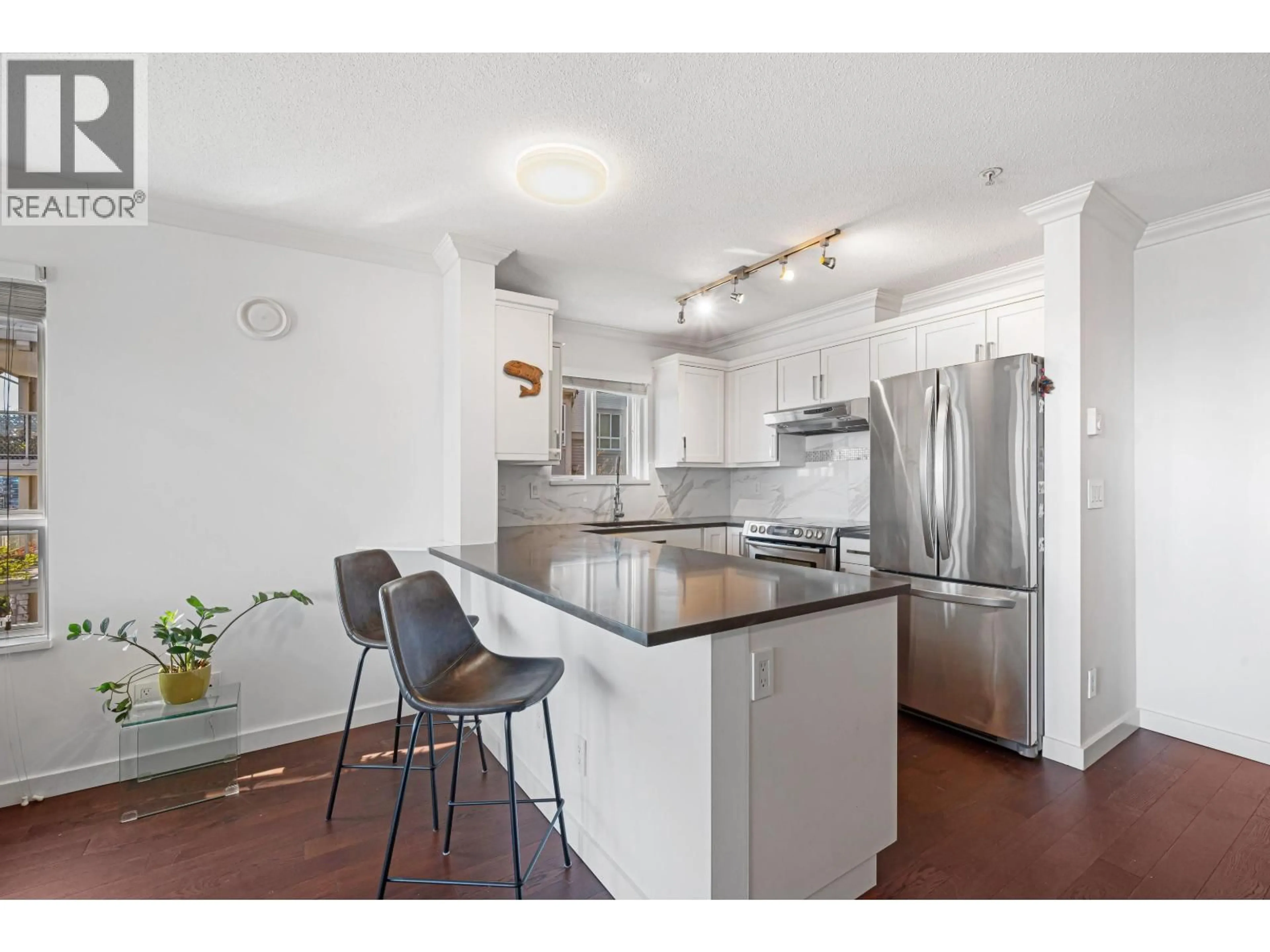 Open concept kitchen, unknown for 213 - 365 1ST STREET, North Vancouver British Columbia V7L4W5