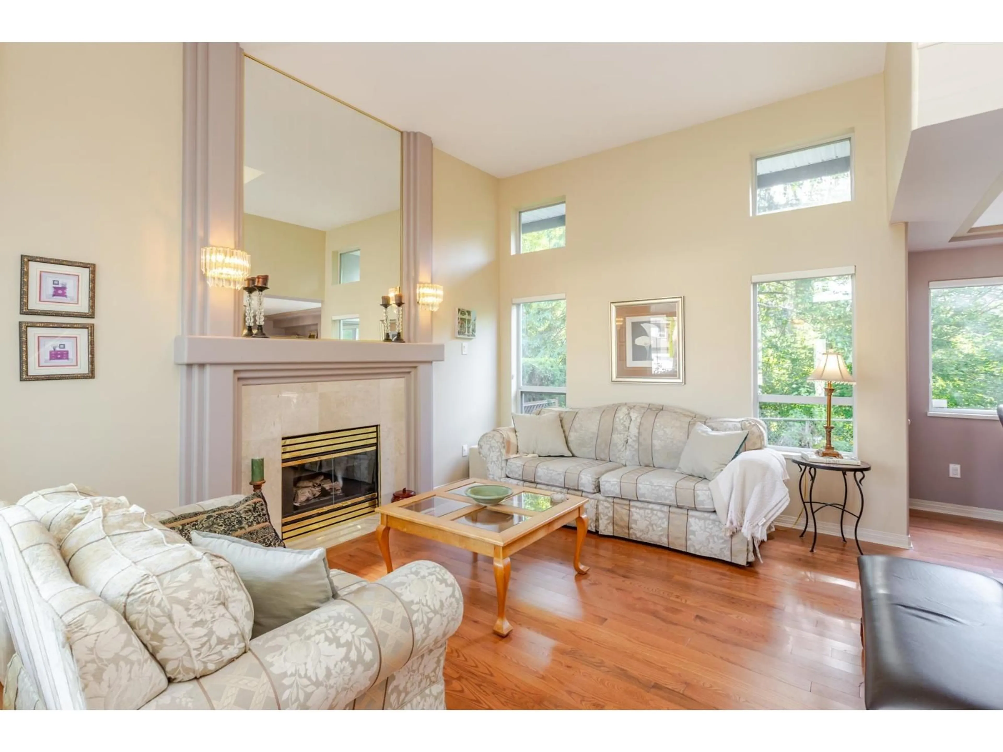 Living room with furniture, wood/laminate floor for 7931 REDTAIL PLACE, Surrey British Columbia V3W0N4