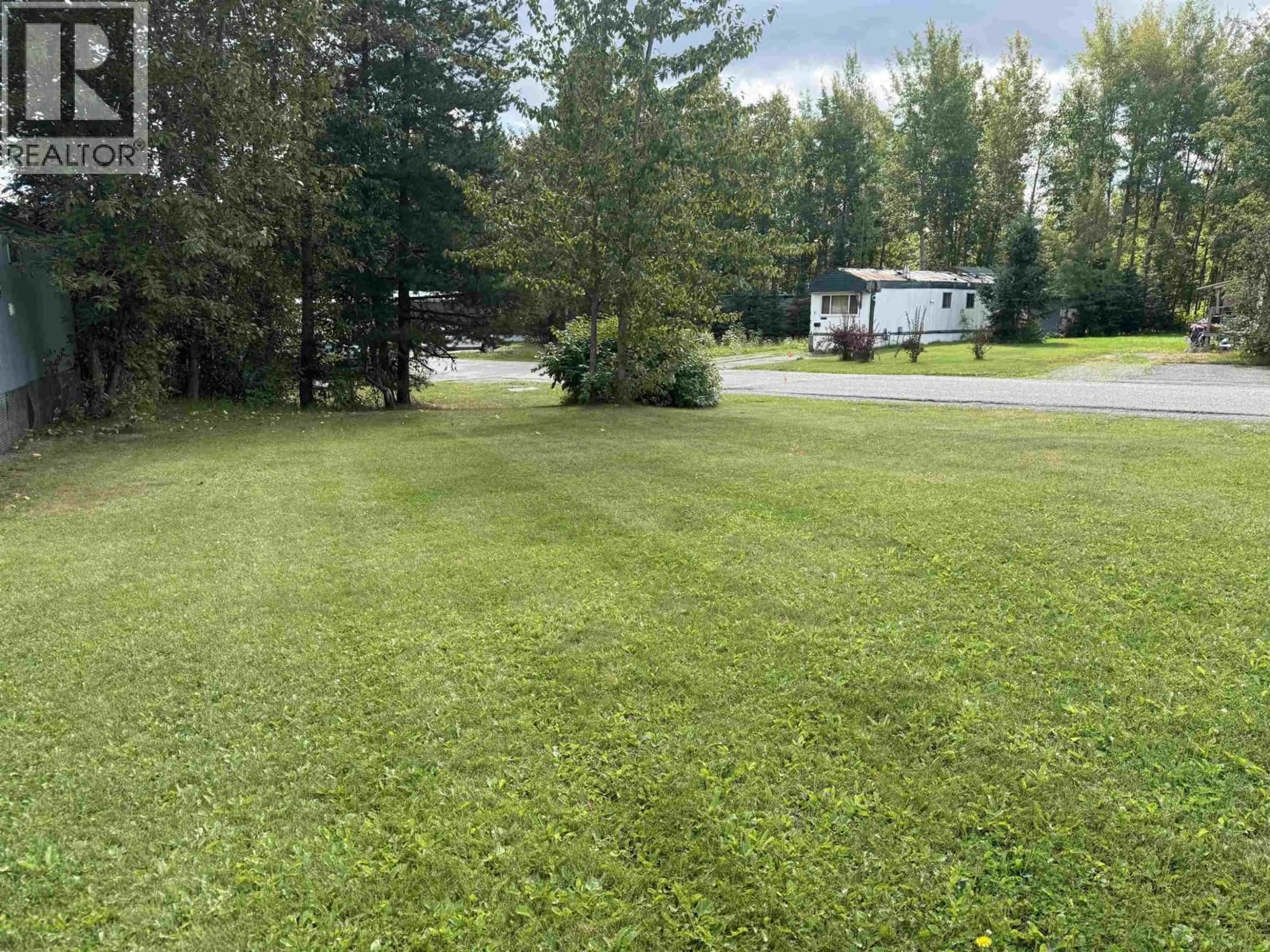 A pic from outside/outdoor area/front of a property/back of a property/a pic from drone, unknown for 103 - 6100 DAKELH, Prince George British Columbia V2N4R1