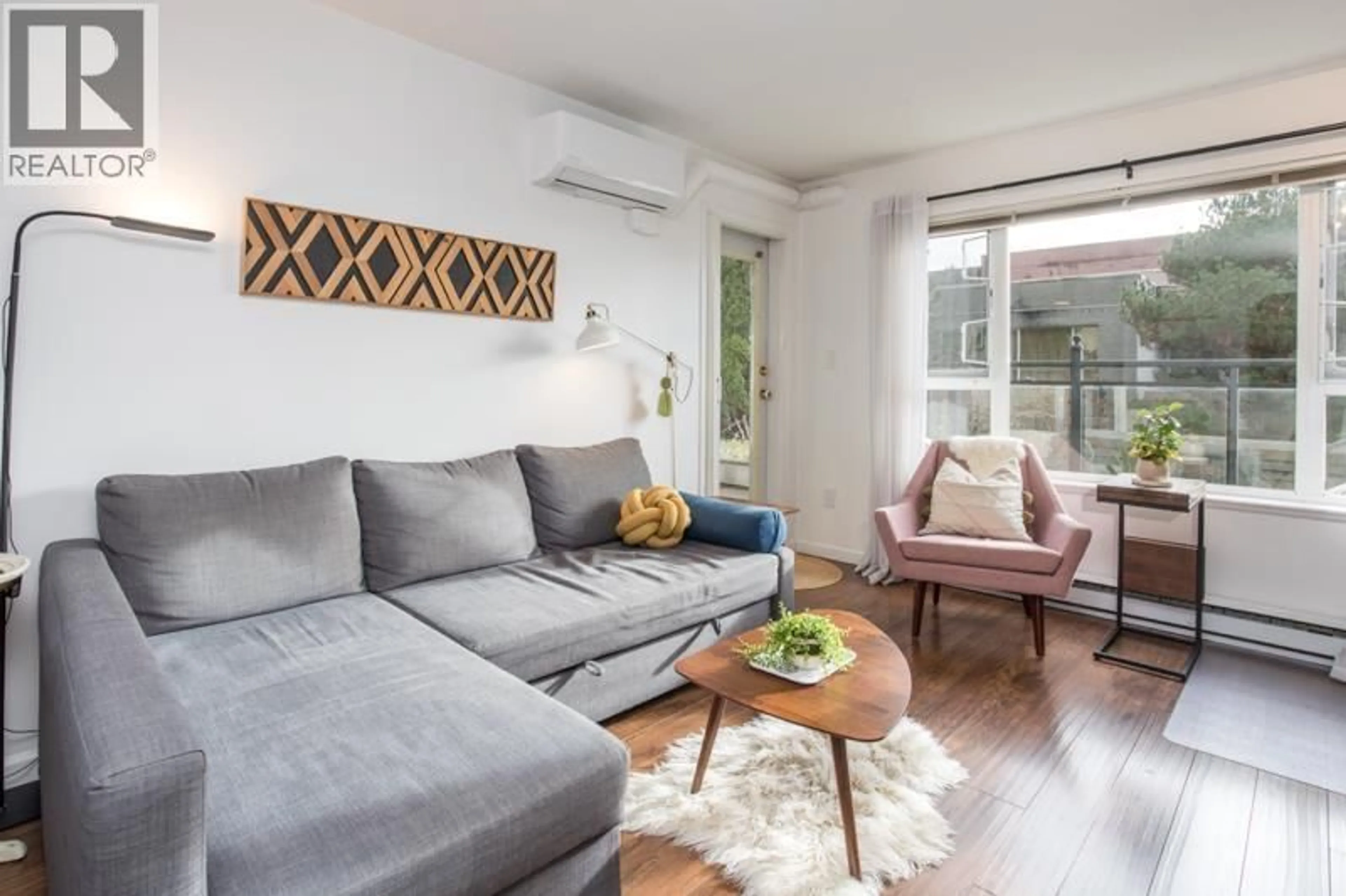 Living room with furniture, wood/laminate floor for 303 - 221 ELEVENTH STREET, New Westminster British Columbia V3M4C8