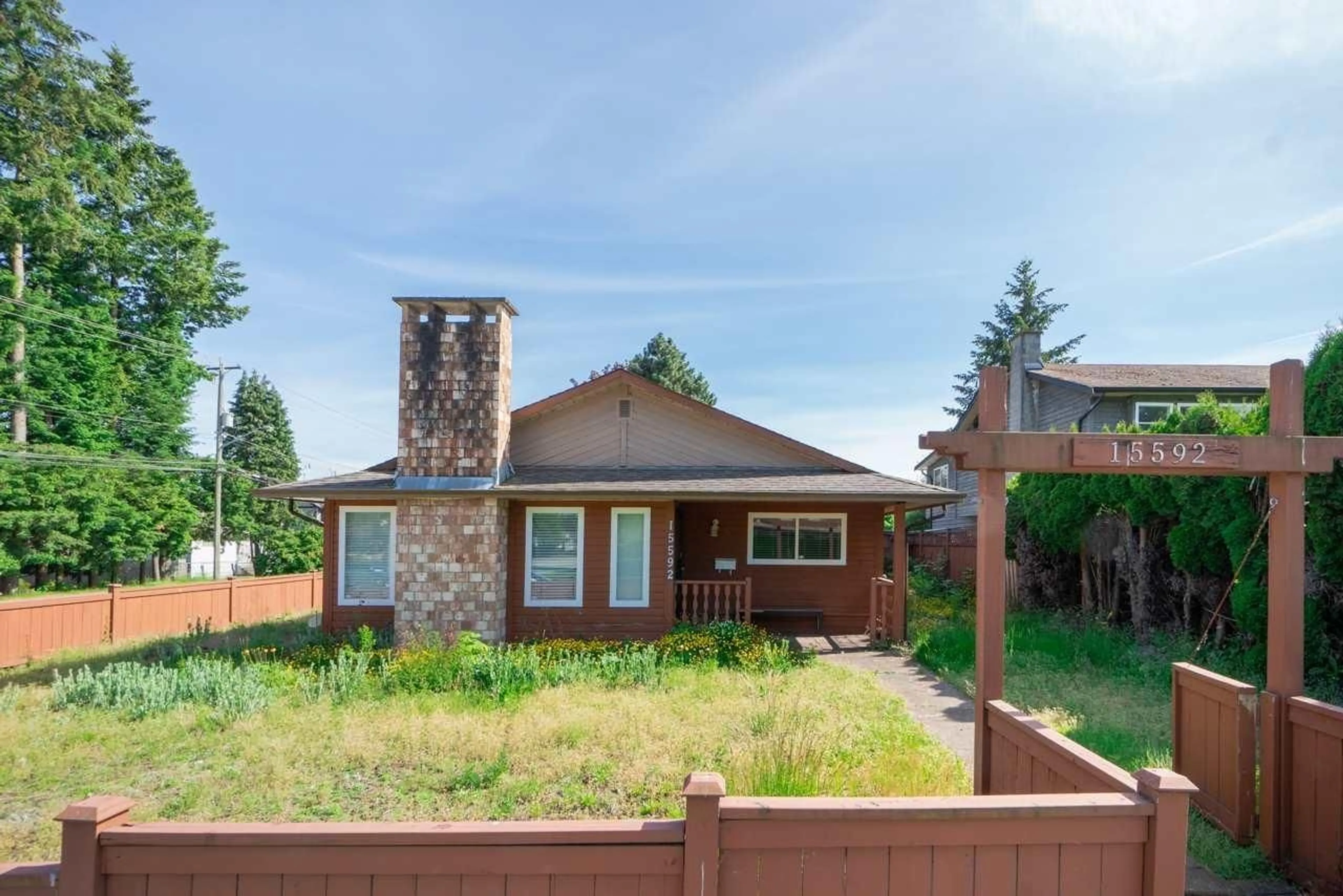 Home with brick exterior material, street for 15592 100 AVENUE, Surrey British Columbia V3R7S4