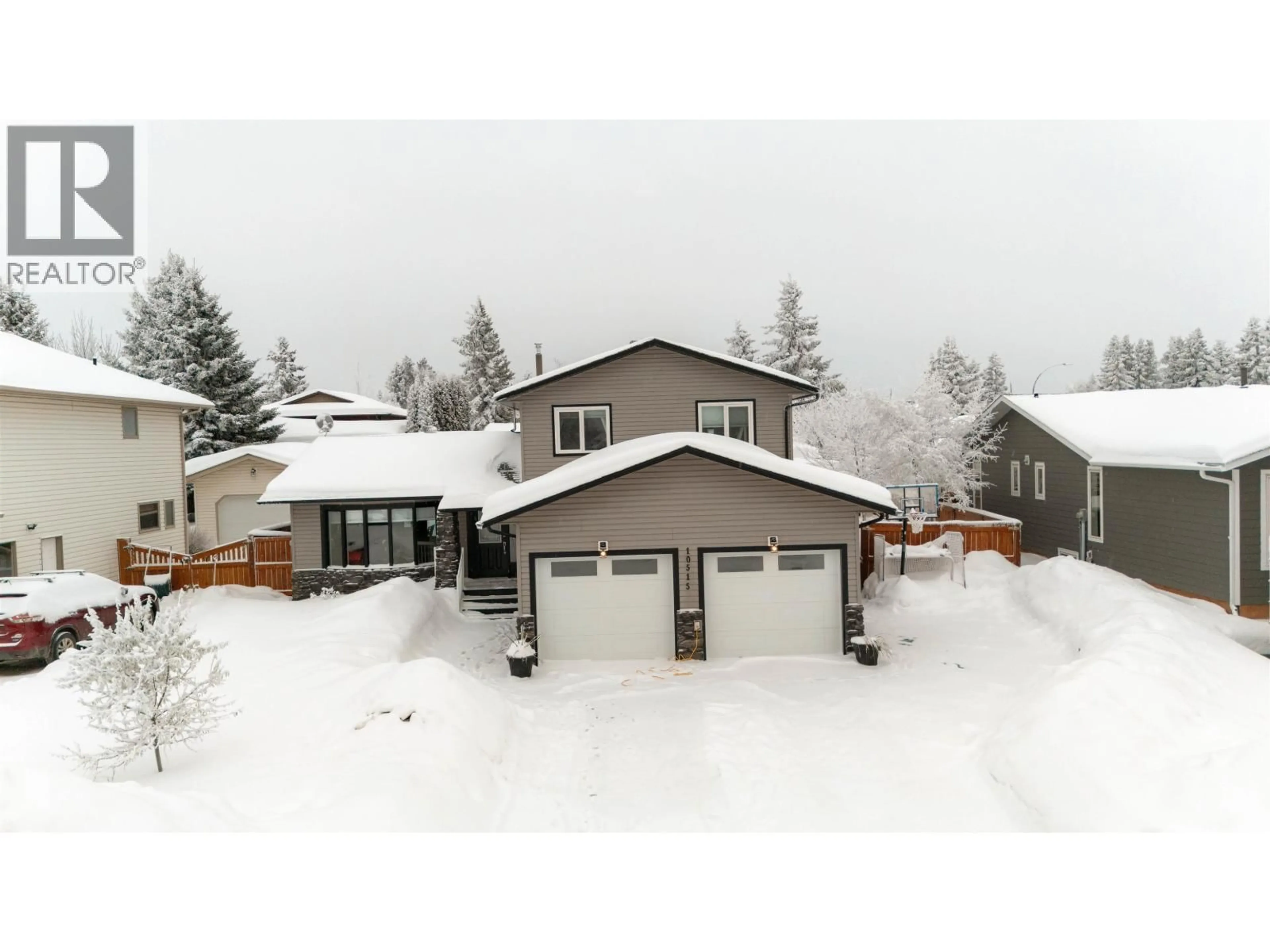 A pic from outside/outdoor area/front of a property/back of a property/a pic from drone, mountain view for 10515 114 AVENUE, Fort St. John British Columbia V1J6H7