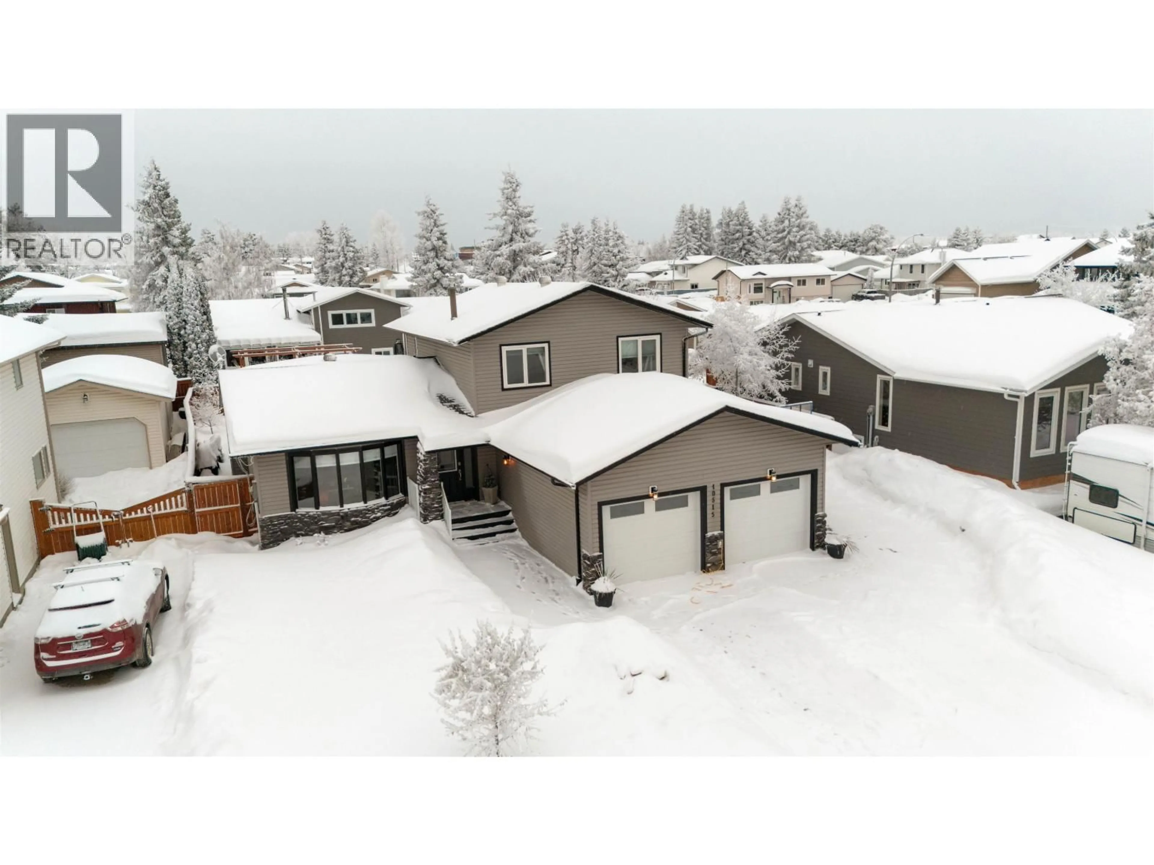 A pic from outside/outdoor area/front of a property/back of a property/a pic from drone, mountain view for 10515 114 AVENUE, Fort St. John British Columbia V1J6H7