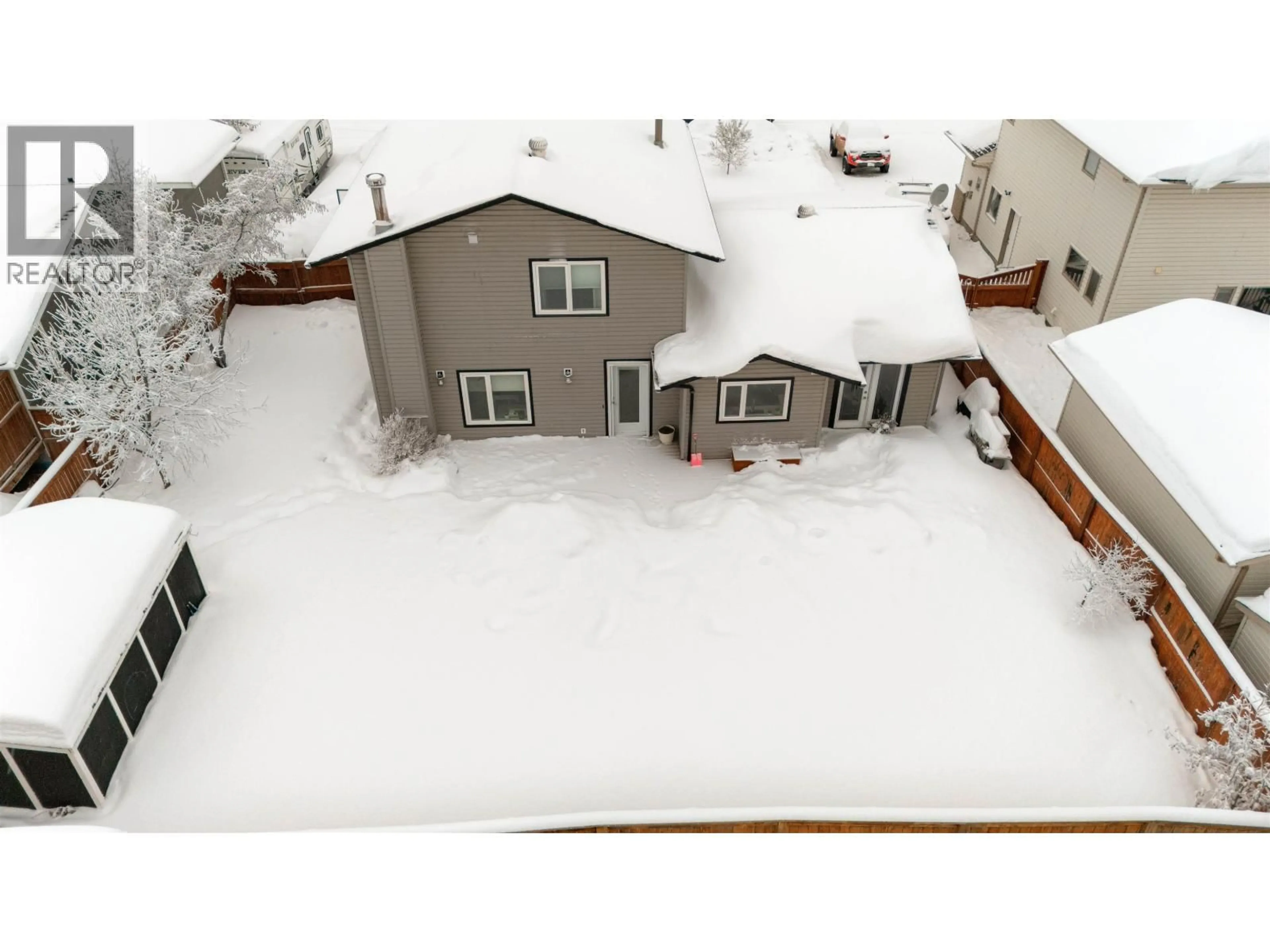 A pic from outside/outdoor area/front of a property/back of a property/a pic from drone, street for 10515 114 AVENUE, Fort St. John British Columbia V1J6H7