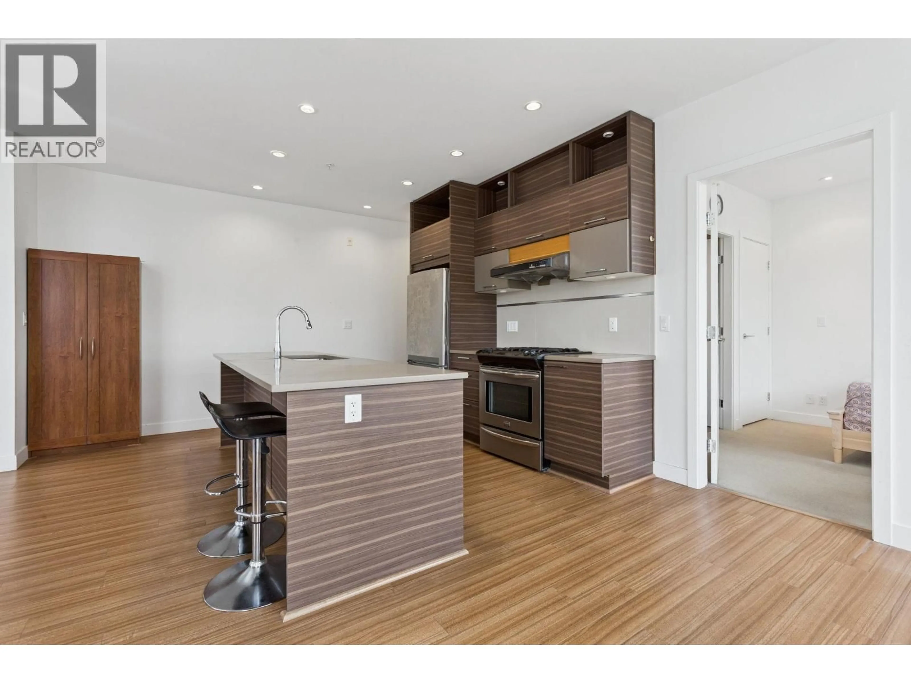 Open concept kitchen, wood/laminate floor for 305 - 9150 UNIVERSITY HIGH STREET, Burnaby British Columbia V5A0C5