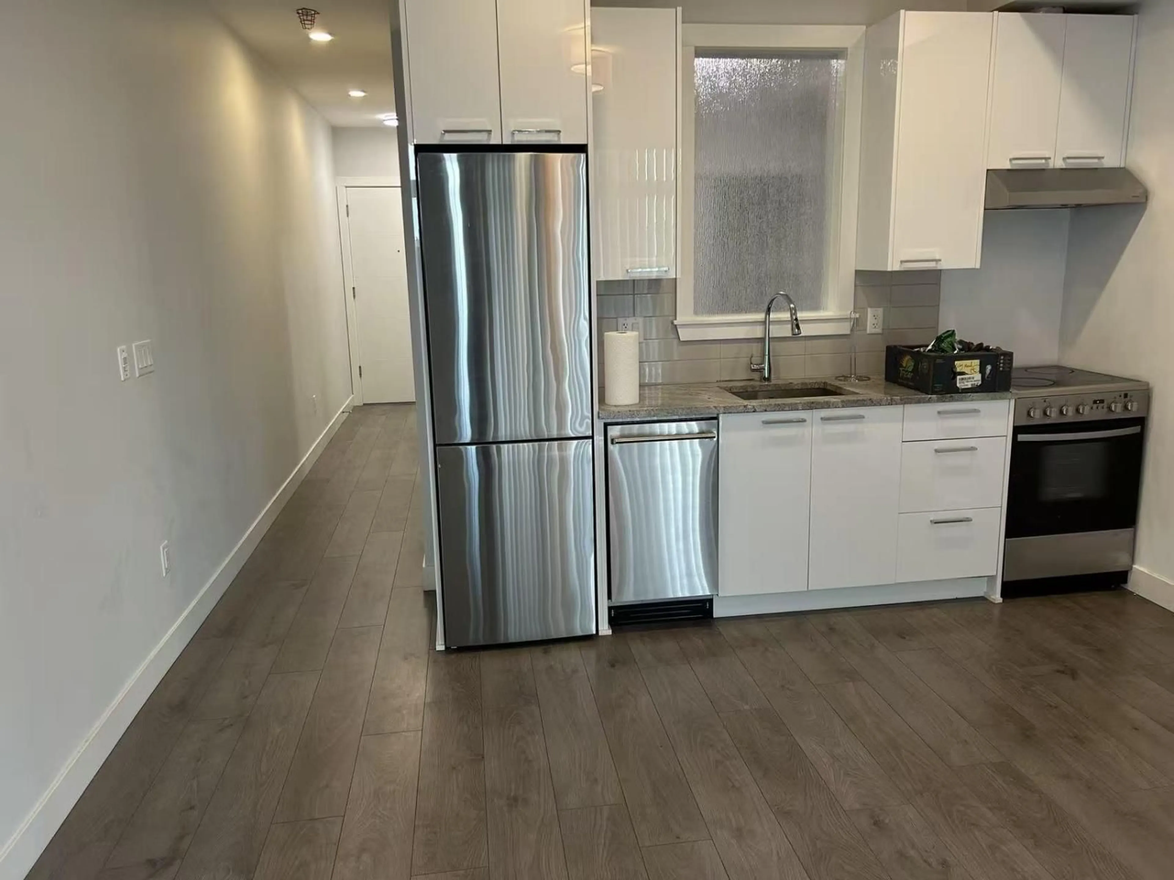 Open concept kitchen, wood/laminate floor for 305 - 20686 EASTLEIGH CRESCENT, Langley British Columbia V3A0M4