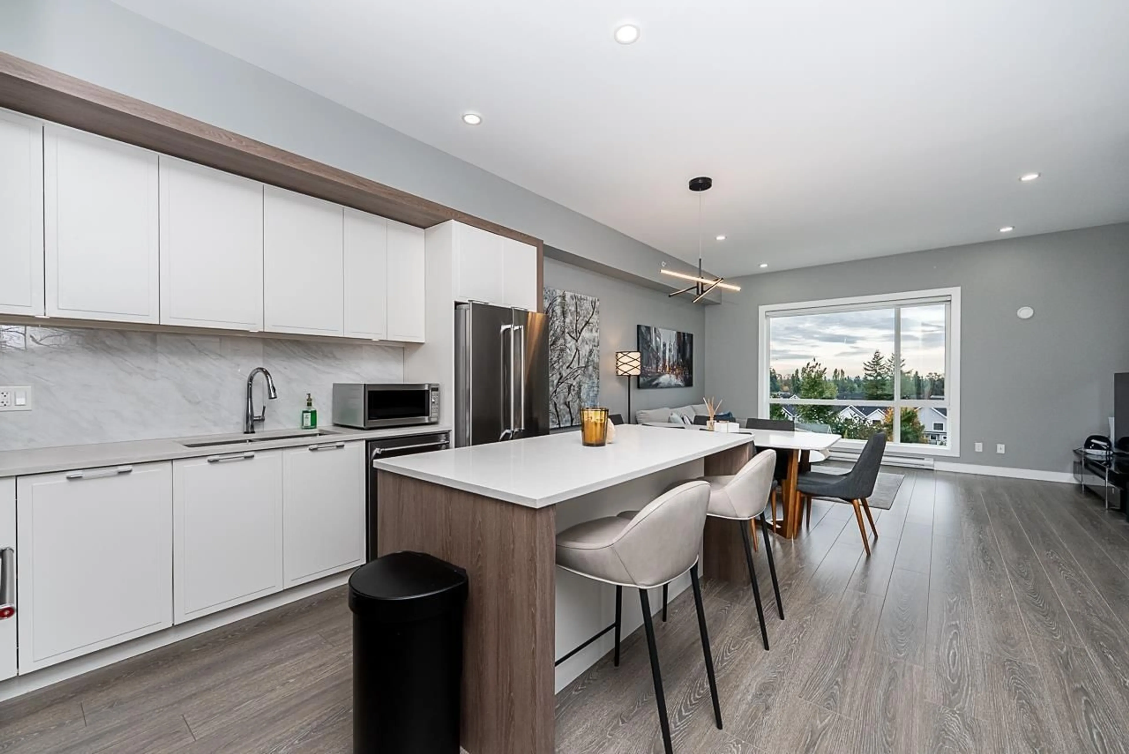 Open concept kitchen, wood/laminate floor for 602 - 11501 84 AVENUE, Delta British Columbia V4C0E5