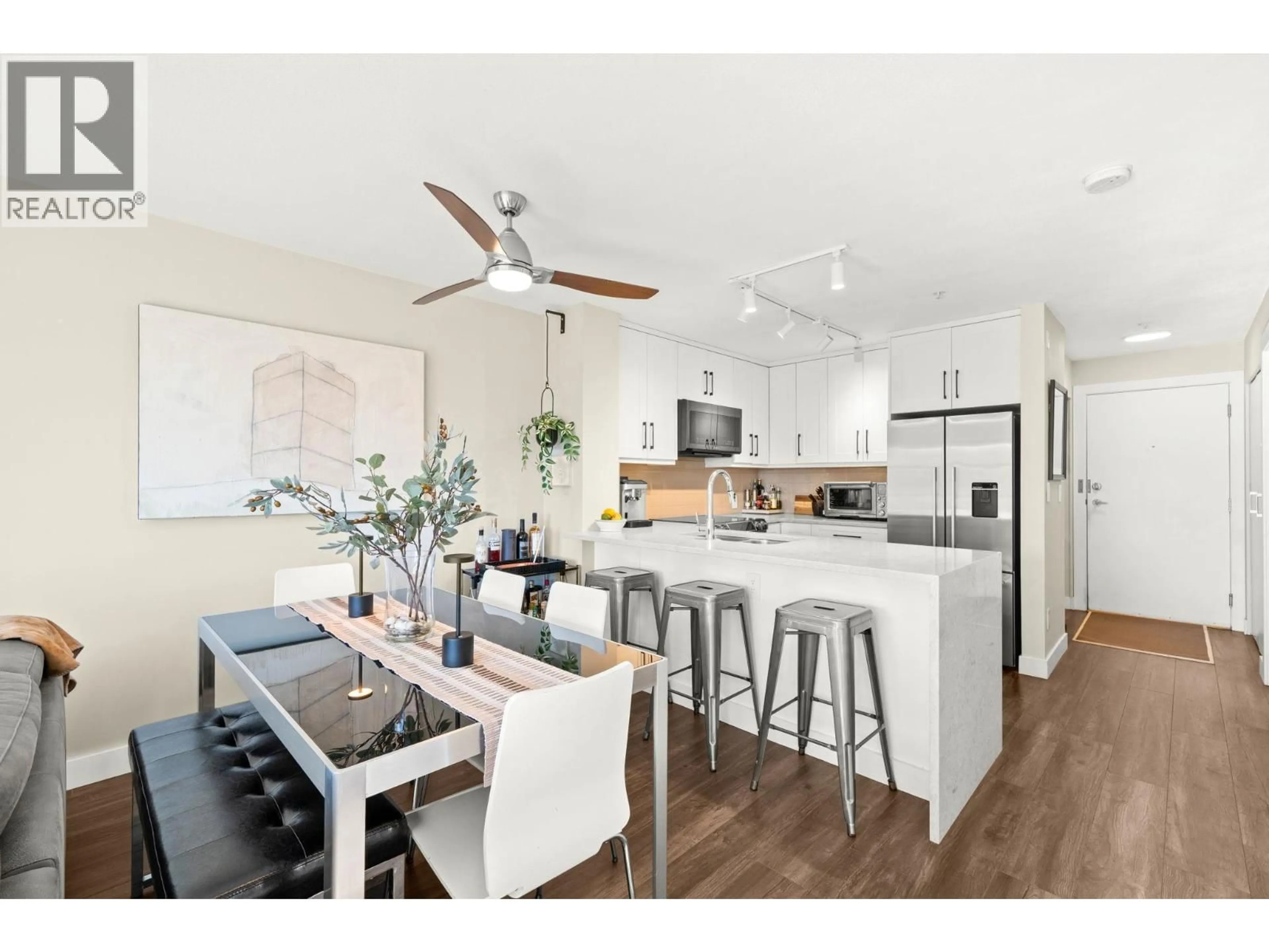 Open concept kitchen, wood/laminate floor for 410 - 124 3RD STREET, North Vancouver British Columbia V7M1E8