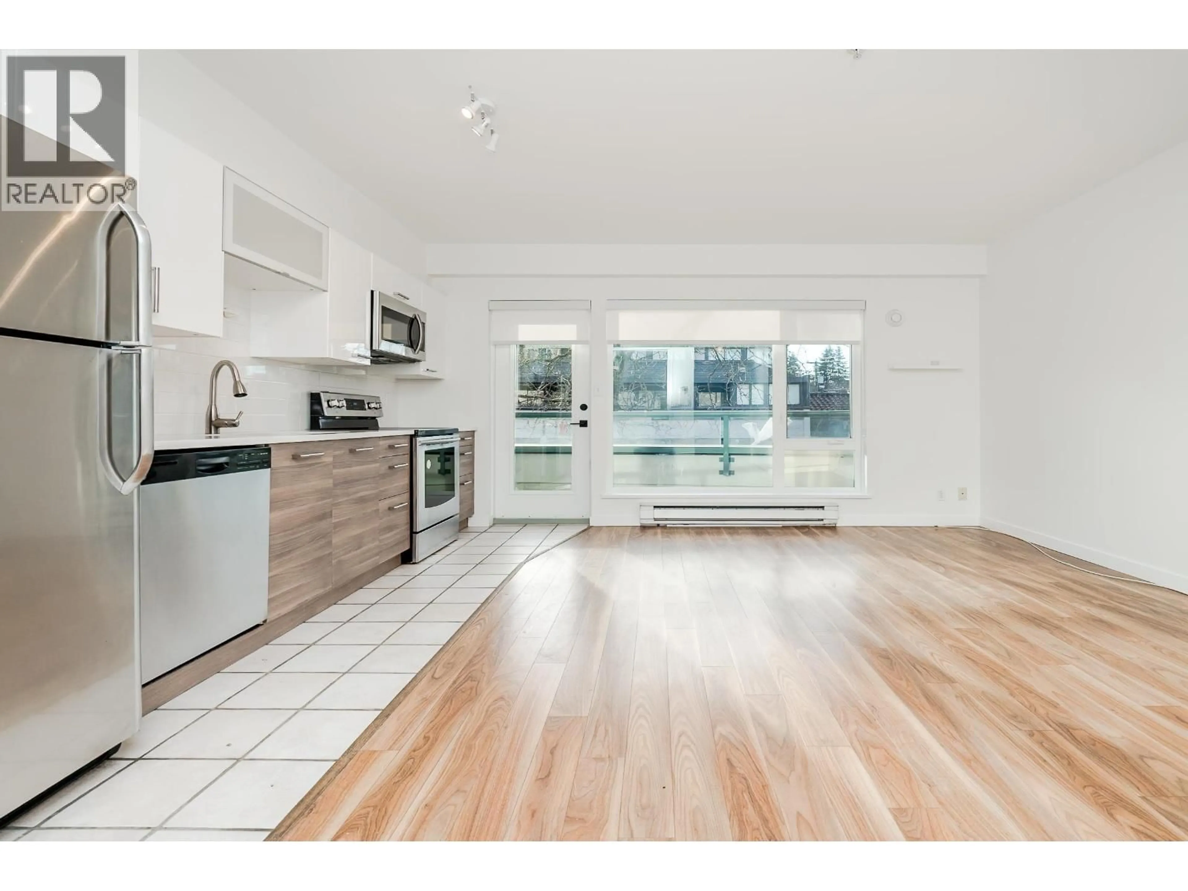 Open concept kitchen, wood/laminate floor for 206 - 1688 CYPRESS STREET, Vancouver British Columbia V6J5J1