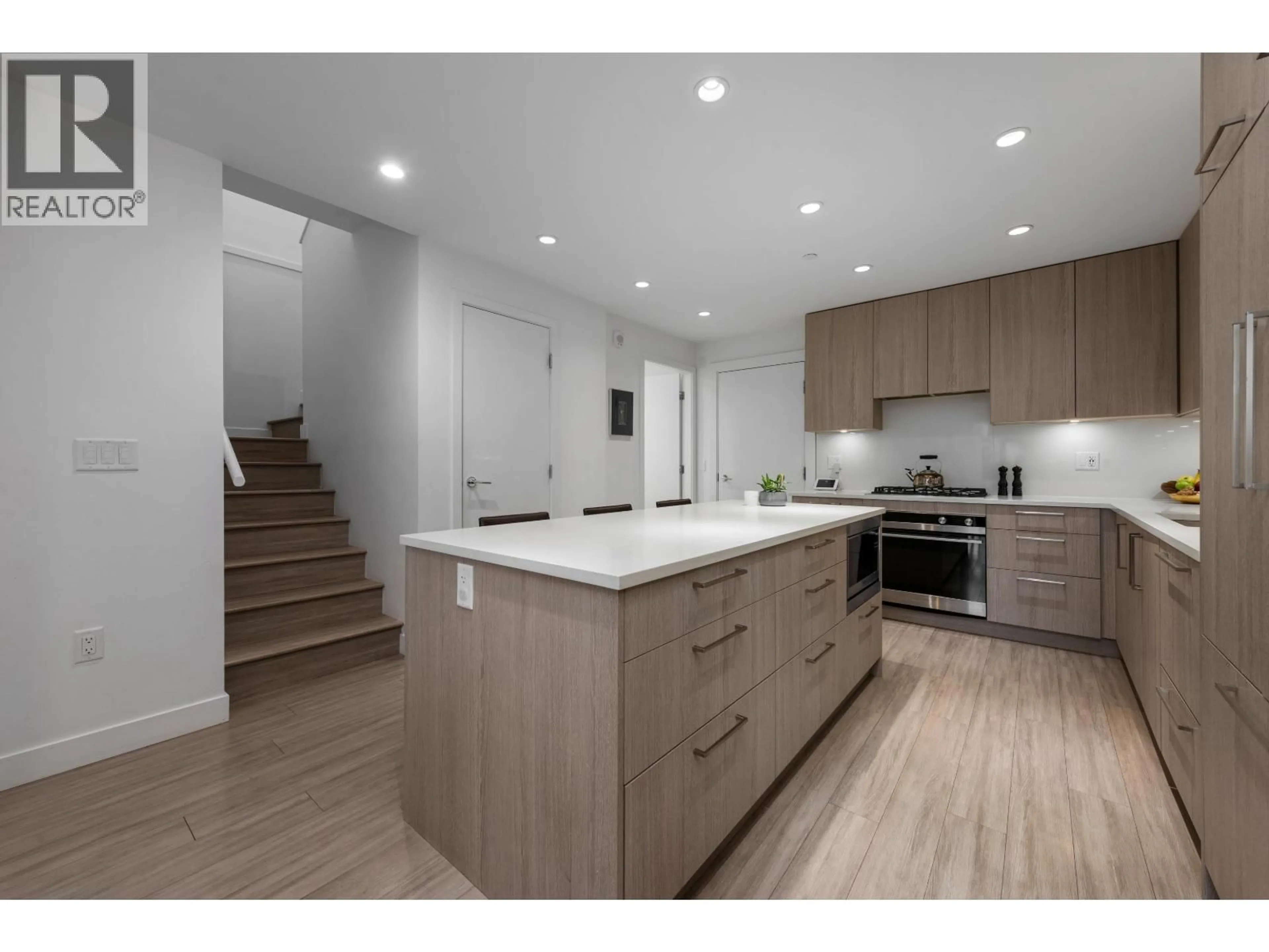 Open concept kitchen, wood/laminate floor for 110 - 733 3RD STREET, North Vancouver British Columbia V7L1G8