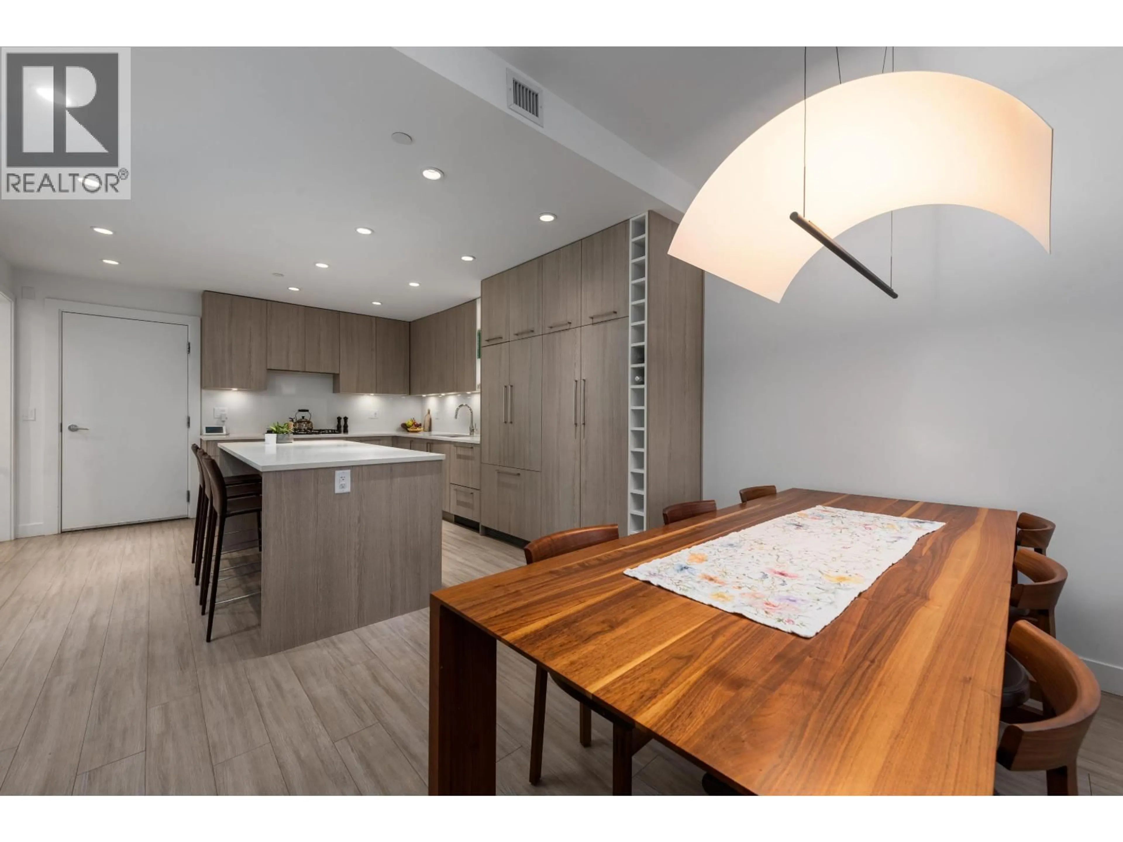 Open concept kitchen, wood/laminate floor for 110 - 733 3RD STREET, North Vancouver British Columbia V7L1G8