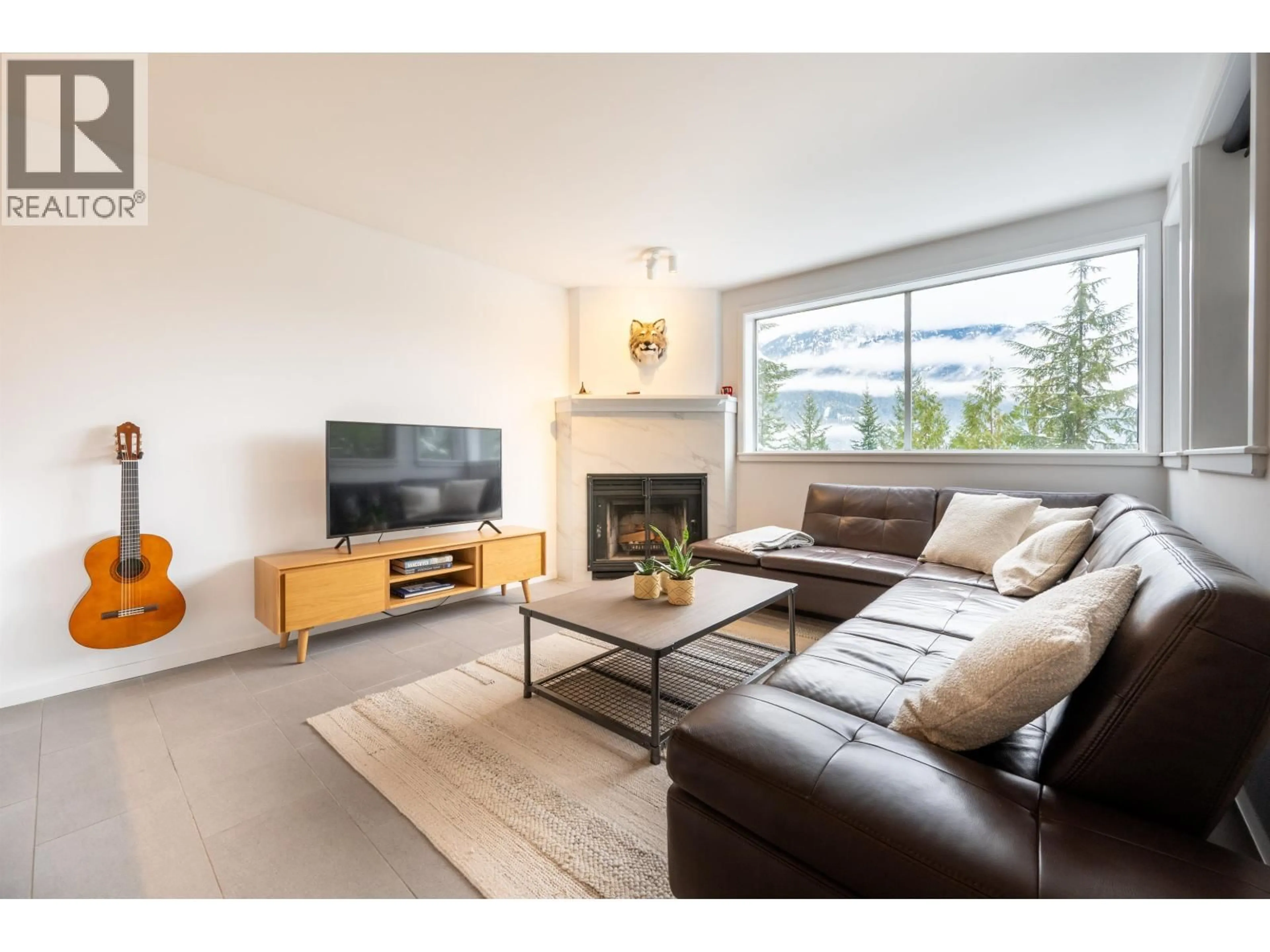 Living room with furniture, wood/laminate floor for 14 - 2240 GONDOLA WAY, Whistler British Columbia V8E0N1