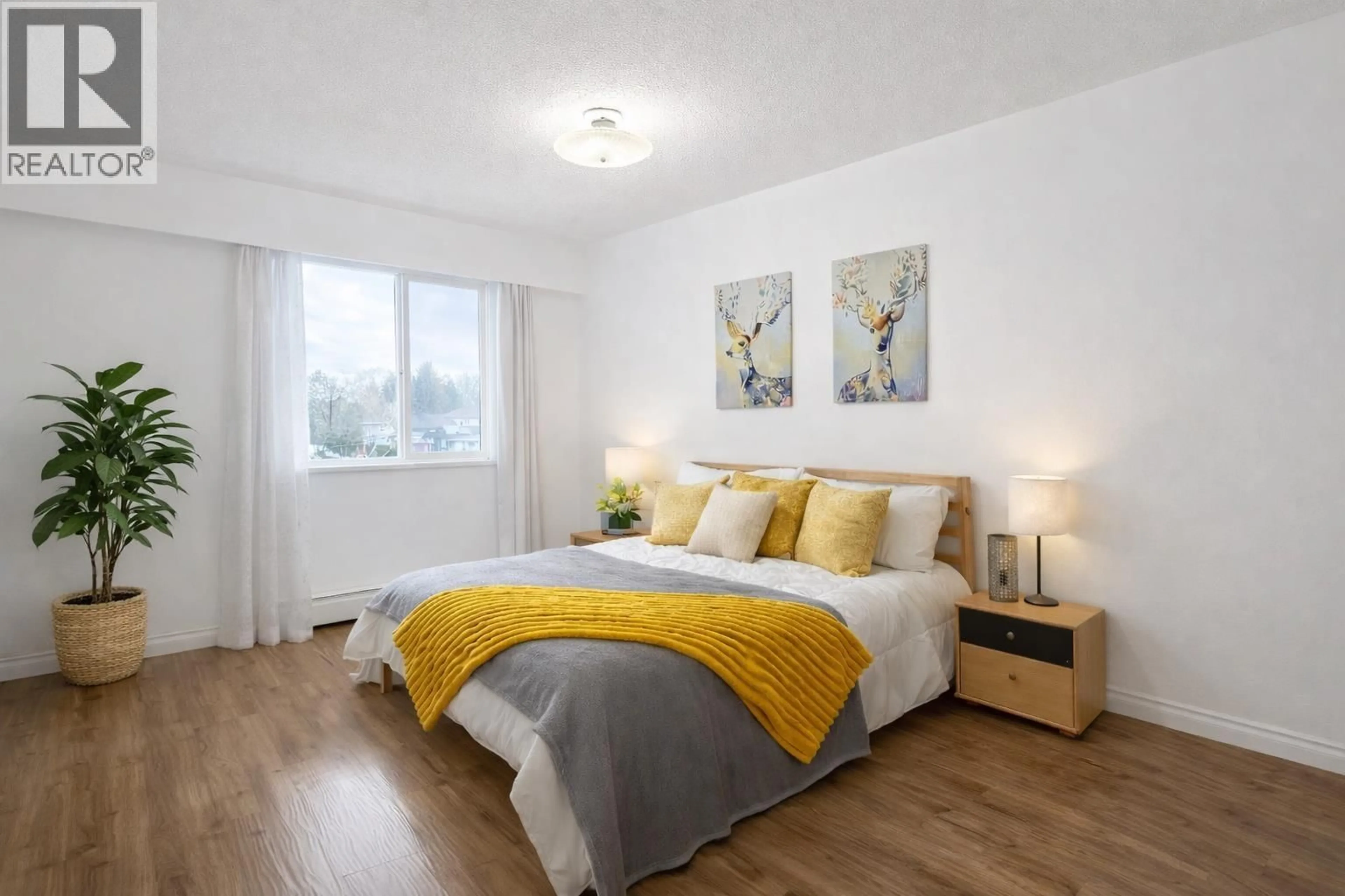 Bedroom with bed, wood/laminate floor for 203 - 2425 SHAUGHNESSY STREET, Port Coquitlam British Columbia V3C3E6