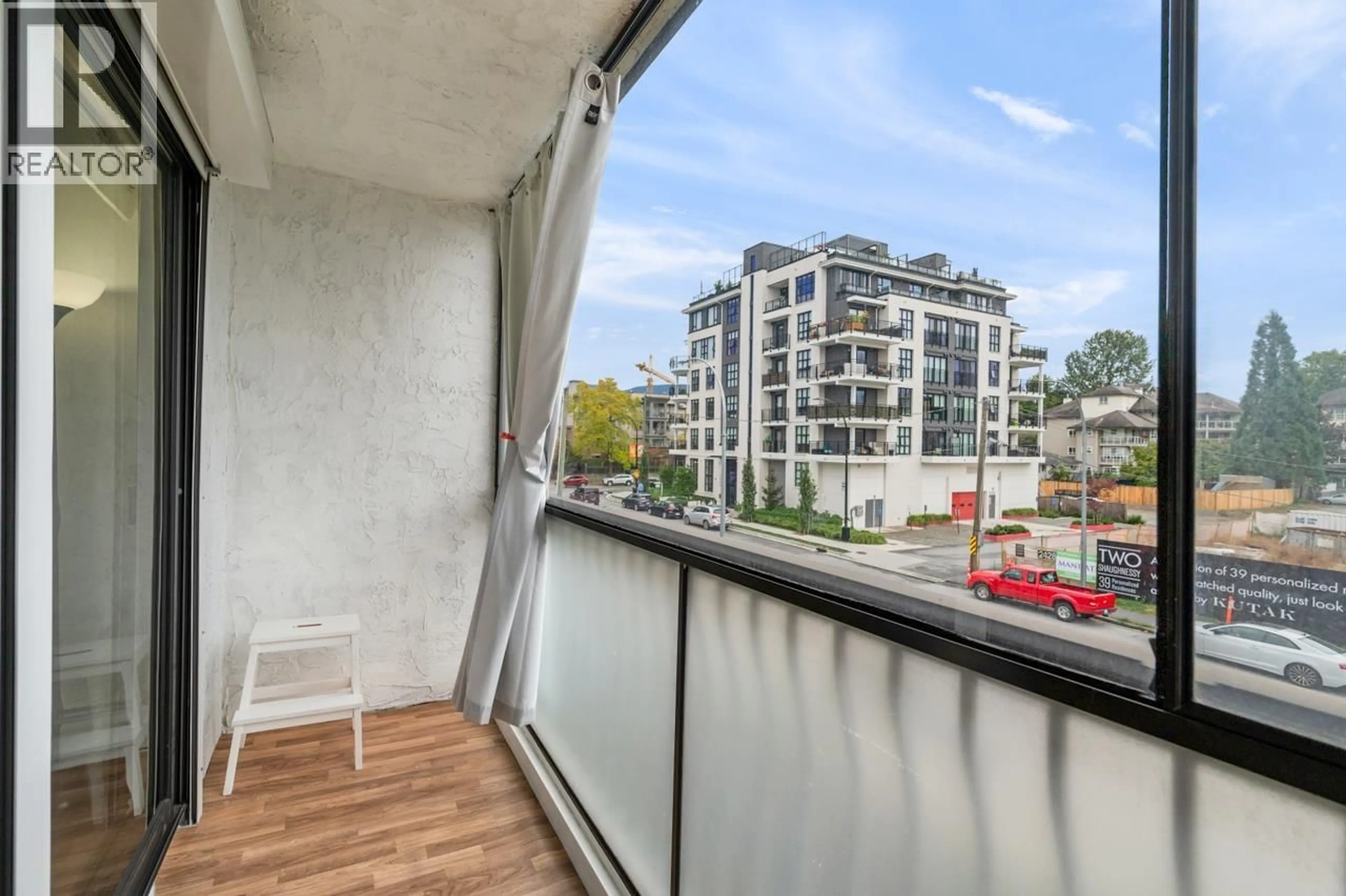 Balcony in the apartment, city buildings view from balcony for 203 - 2425 SHAUGHNESSY STREET, Port Coquitlam British Columbia V3C3E6