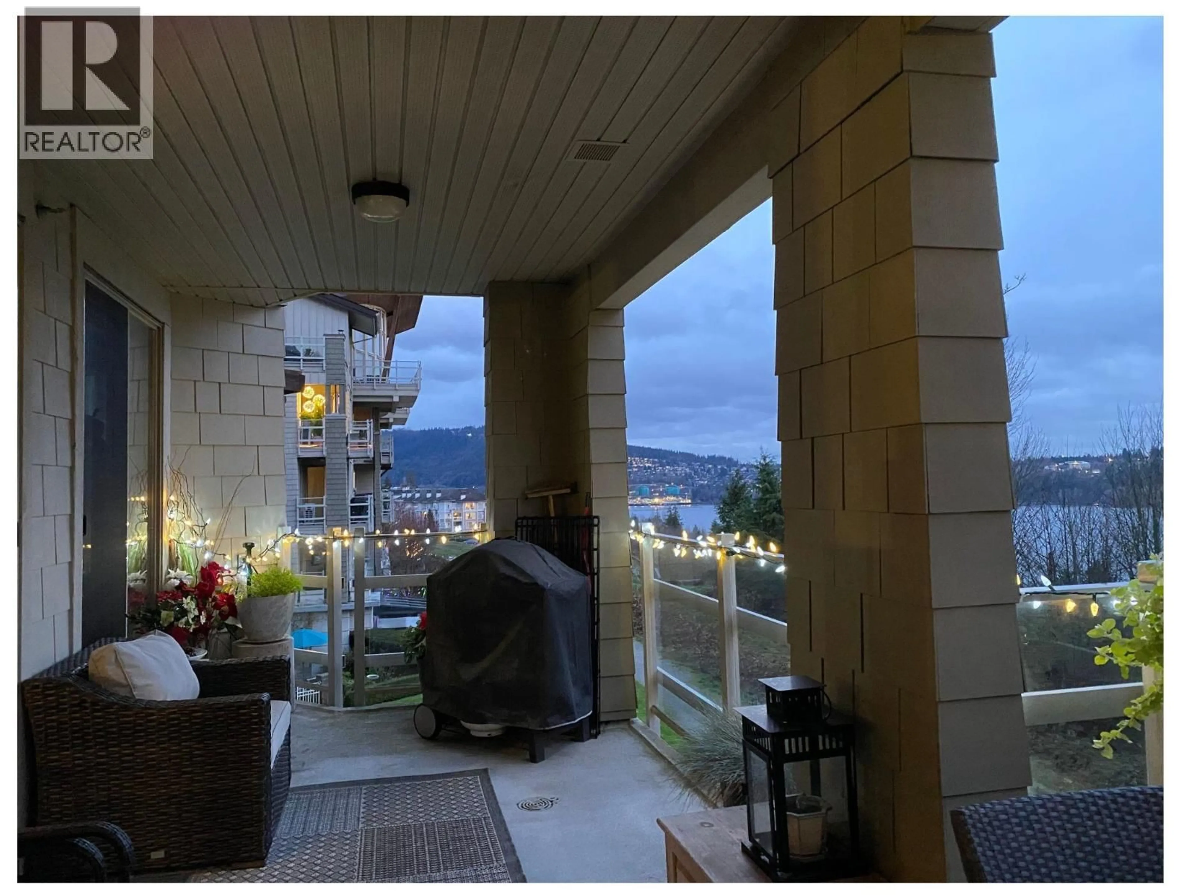 Balcony in the apartment, city buildings view from balcony for 301 - 560 RAVEN WOODS DRIVE, North Vancouver British Columbia V7G2T3