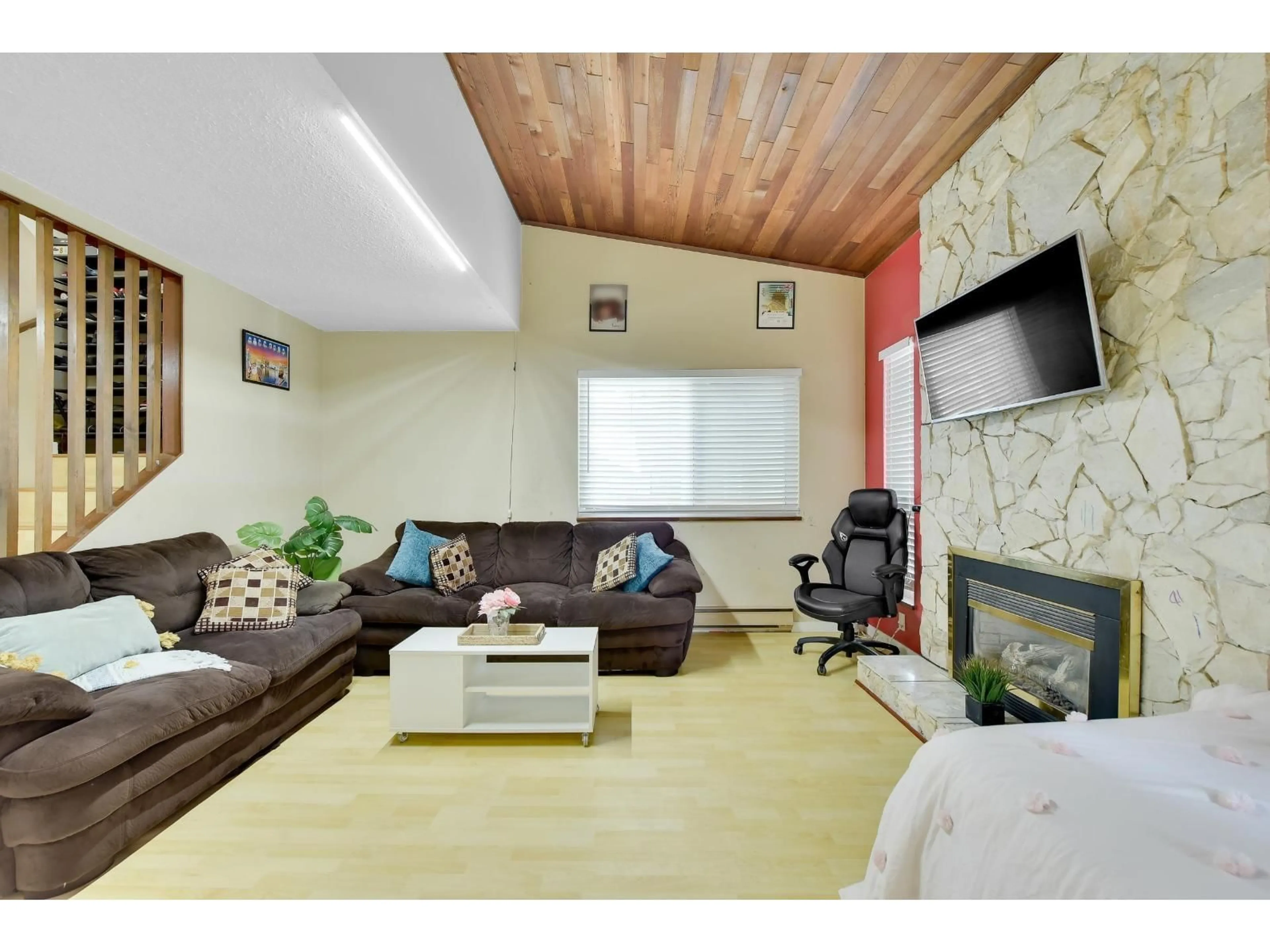 Living room with furniture, wood/laminate floor for 7390 129 STREET, Surrey British Columbia V3W7B8