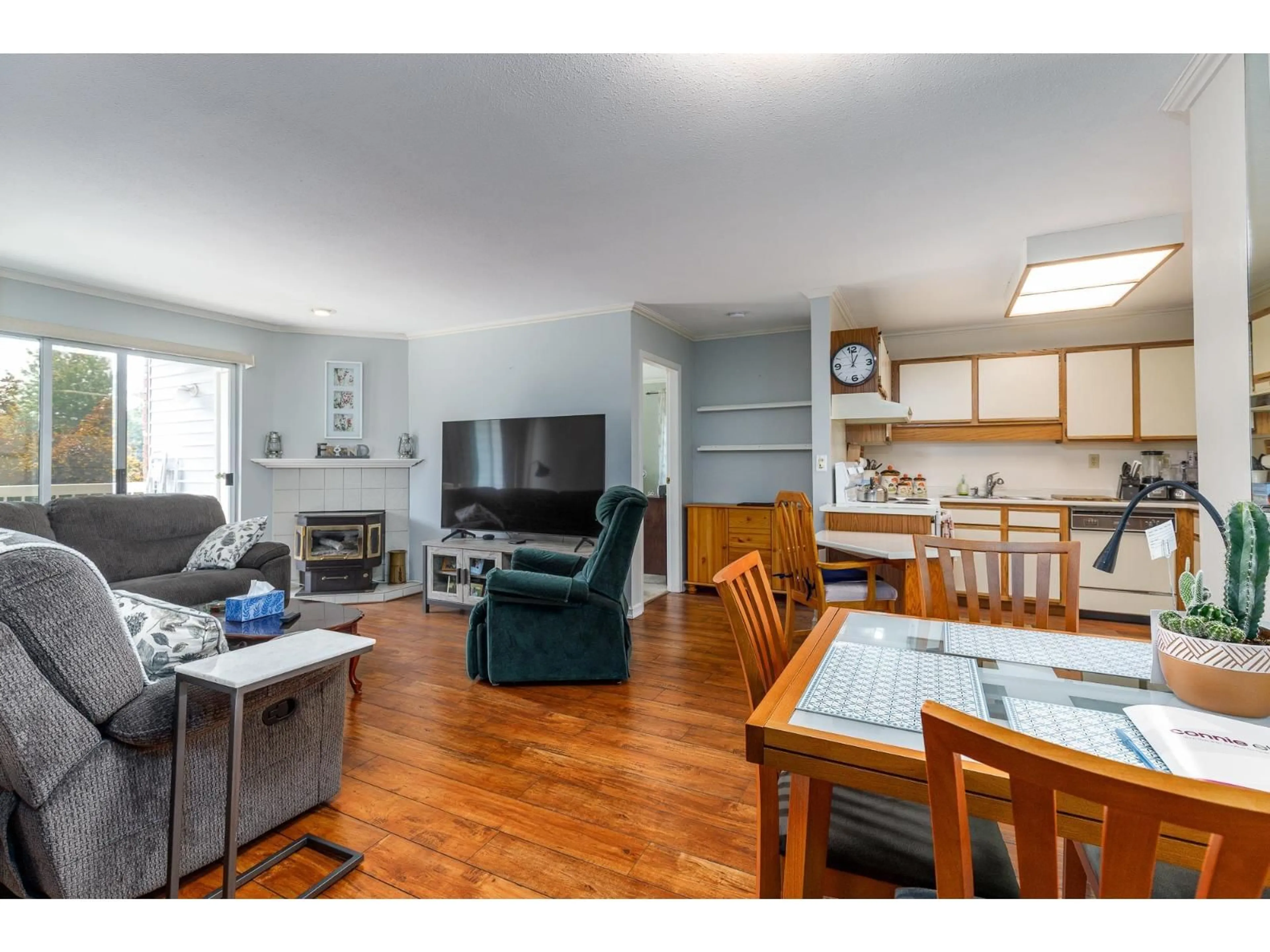 Living room with furniture, wood/laminate floor for 221 - 5379 205 STREET, Langley British Columbia V3A7V7