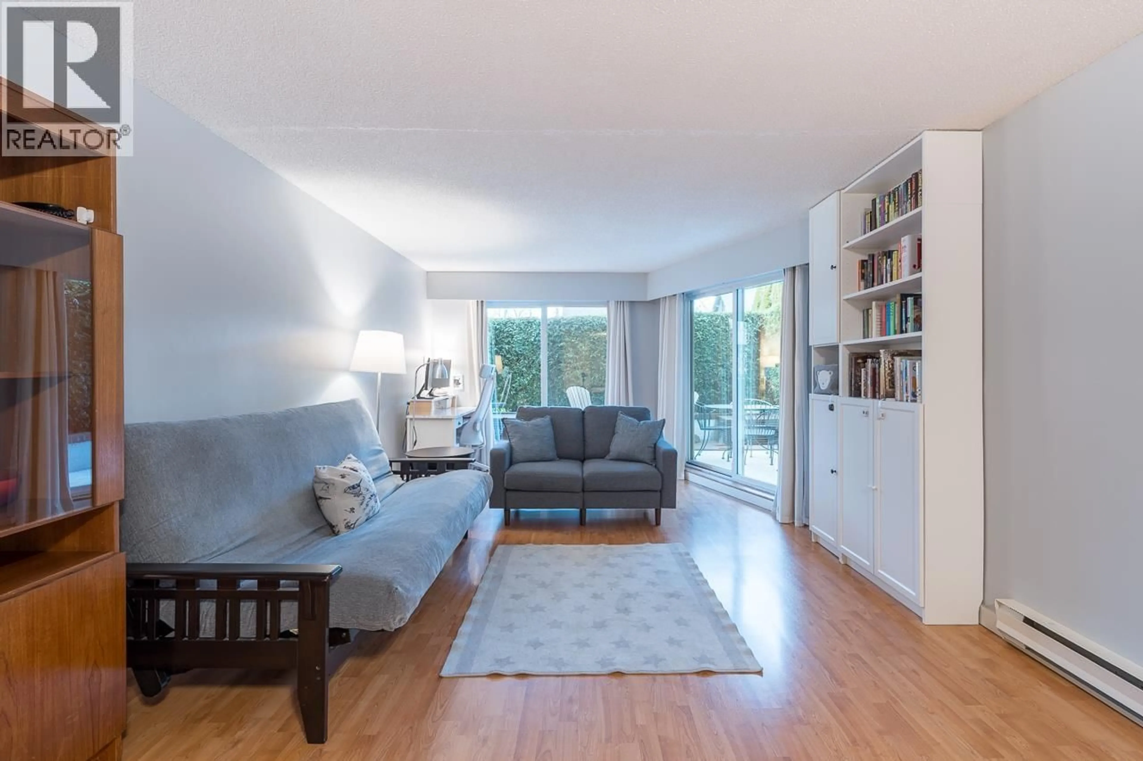 Living room with furniture, wood/laminate floor for 103 - 3353 HEATHER STREET, Vancouver British Columbia V5Z3K6