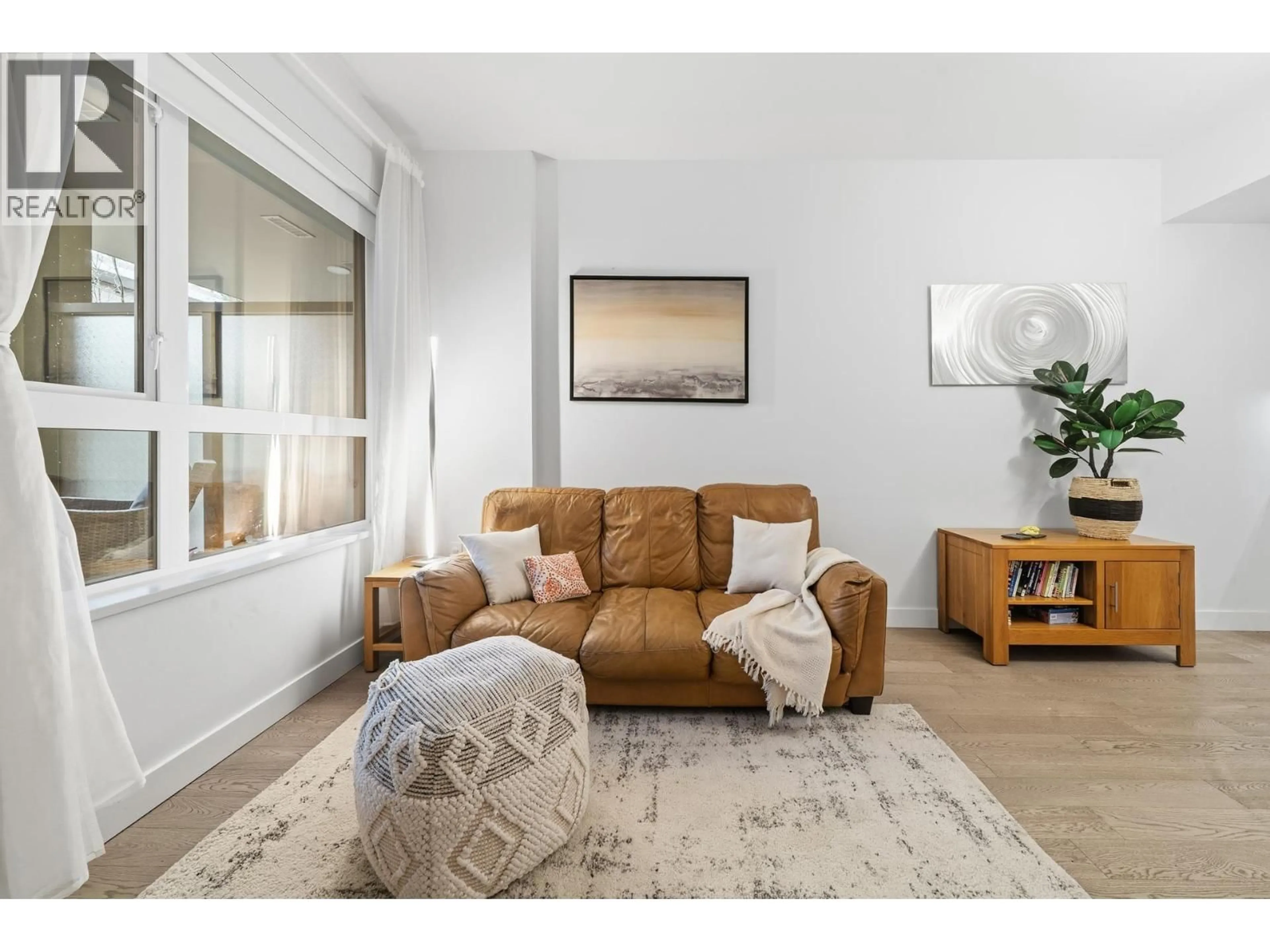 Living room with furniture, unknown for 201 - 3220 CONNAUGHT CRESCENT, North Vancouver British Columbia V7R0A5