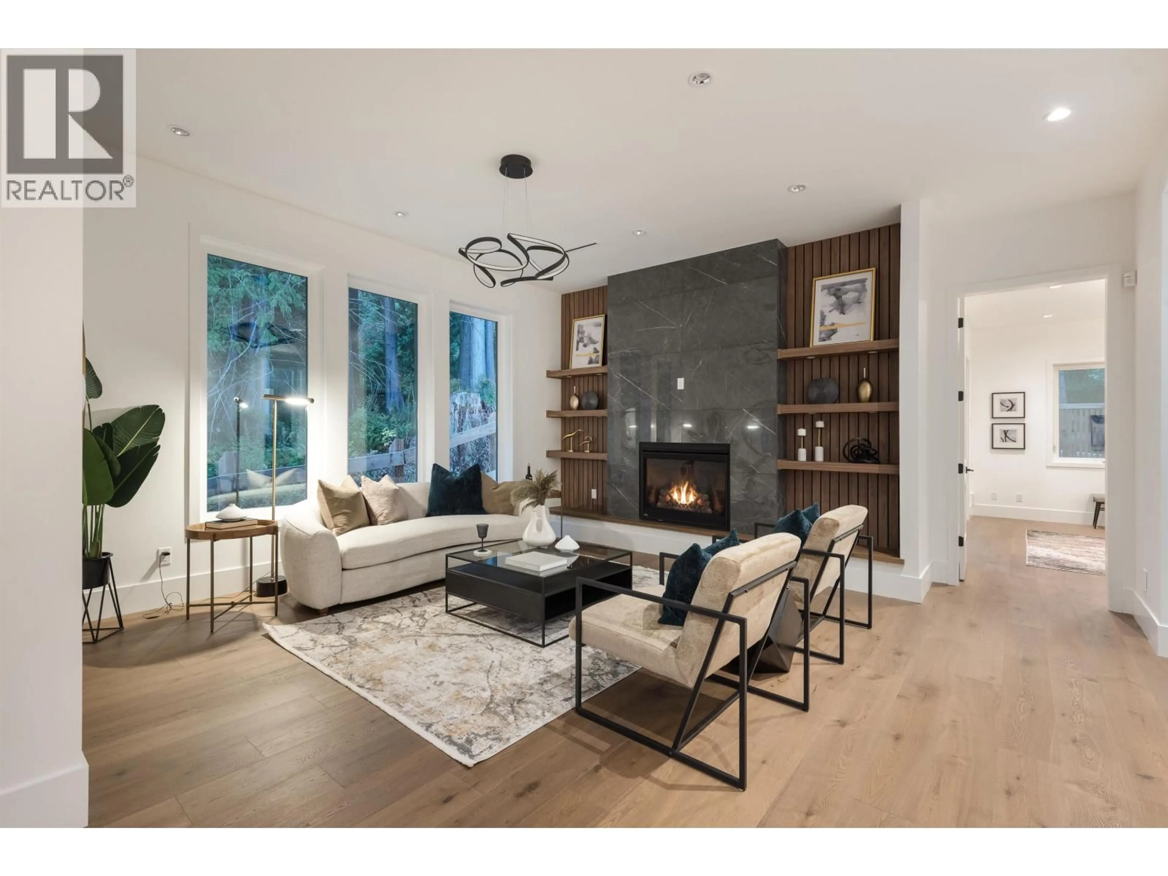 Living room with furniture, wood/laminate floor for 1486 COAST MERIDIAN ROAD, Coquitlam British Columbia V3E0C4