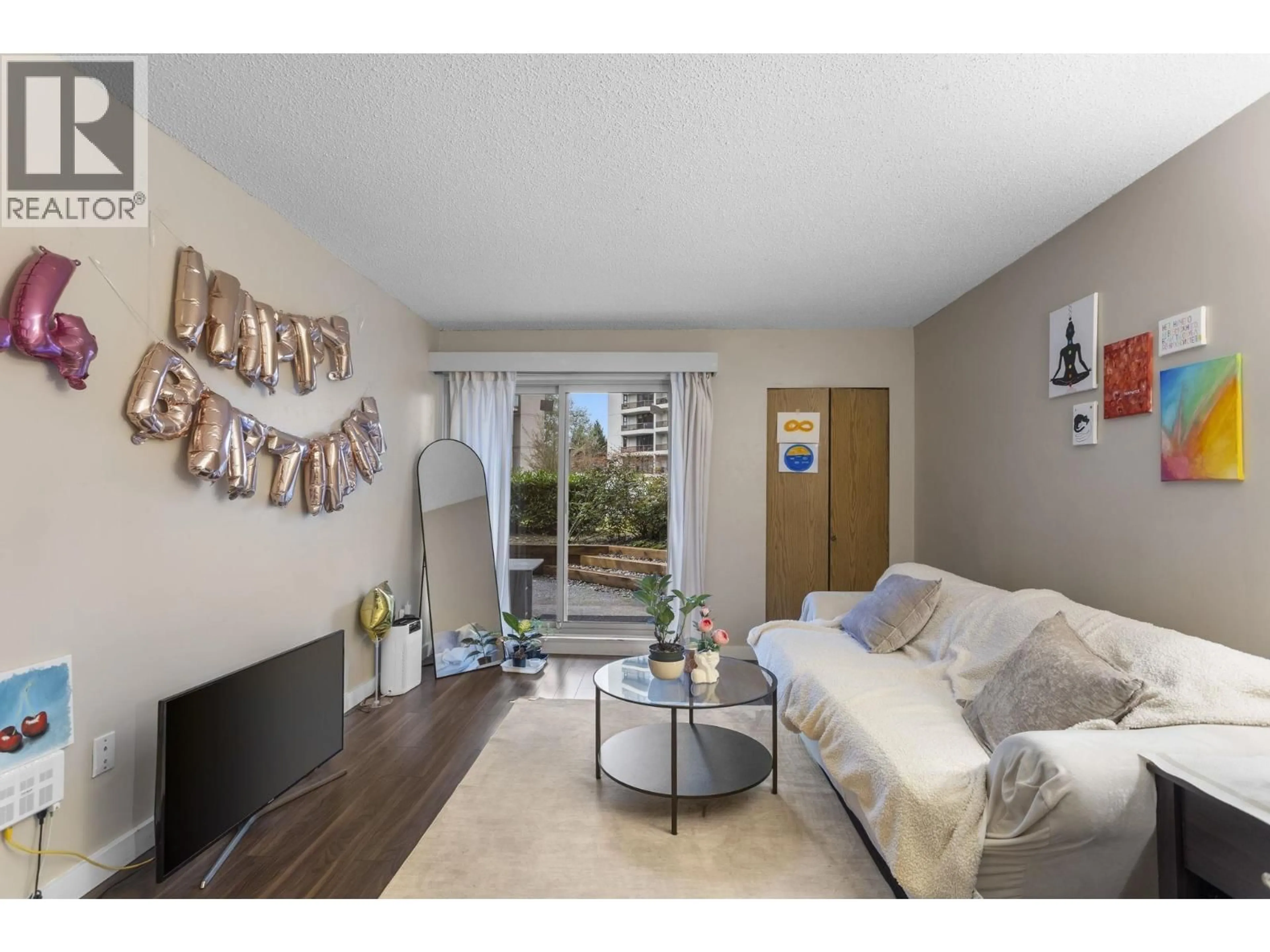 Living room with furniture, wood/laminate floor for 119 - 4363 HALIFAX STREET, Burnaby British Columbia V5C5Z3