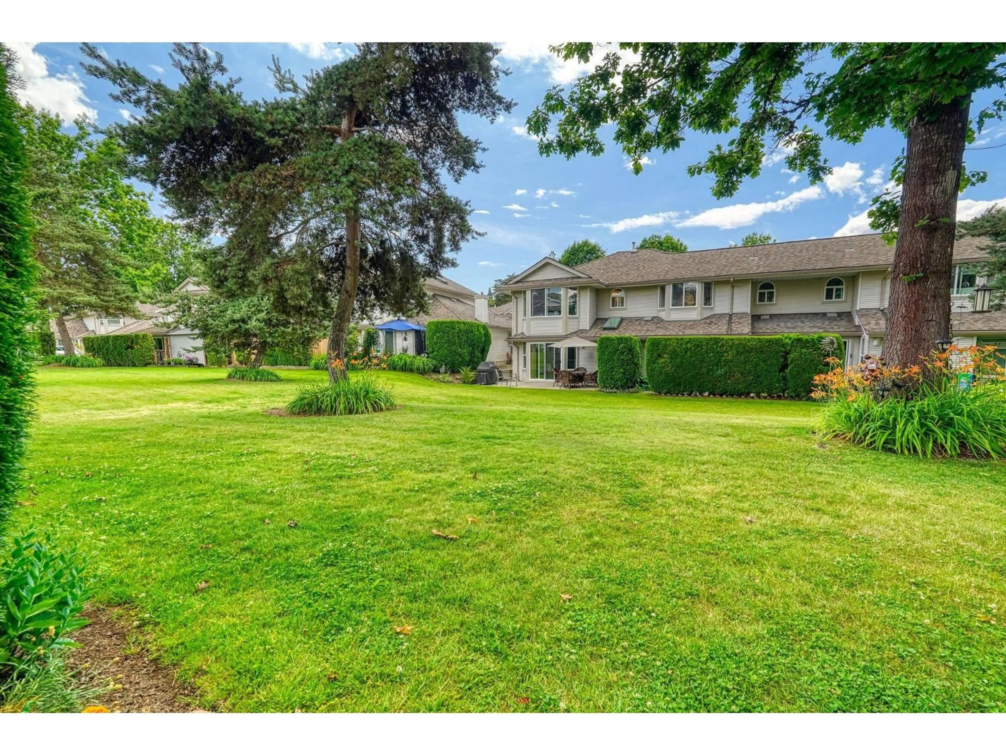 A pic from outside/outdoor area/front of a property/back of a property/a pic from drone, water/lake/river/ocean view for 102 - 9045 WALNUT GROVE DRIVE, Langley British Columbia V1M2E1