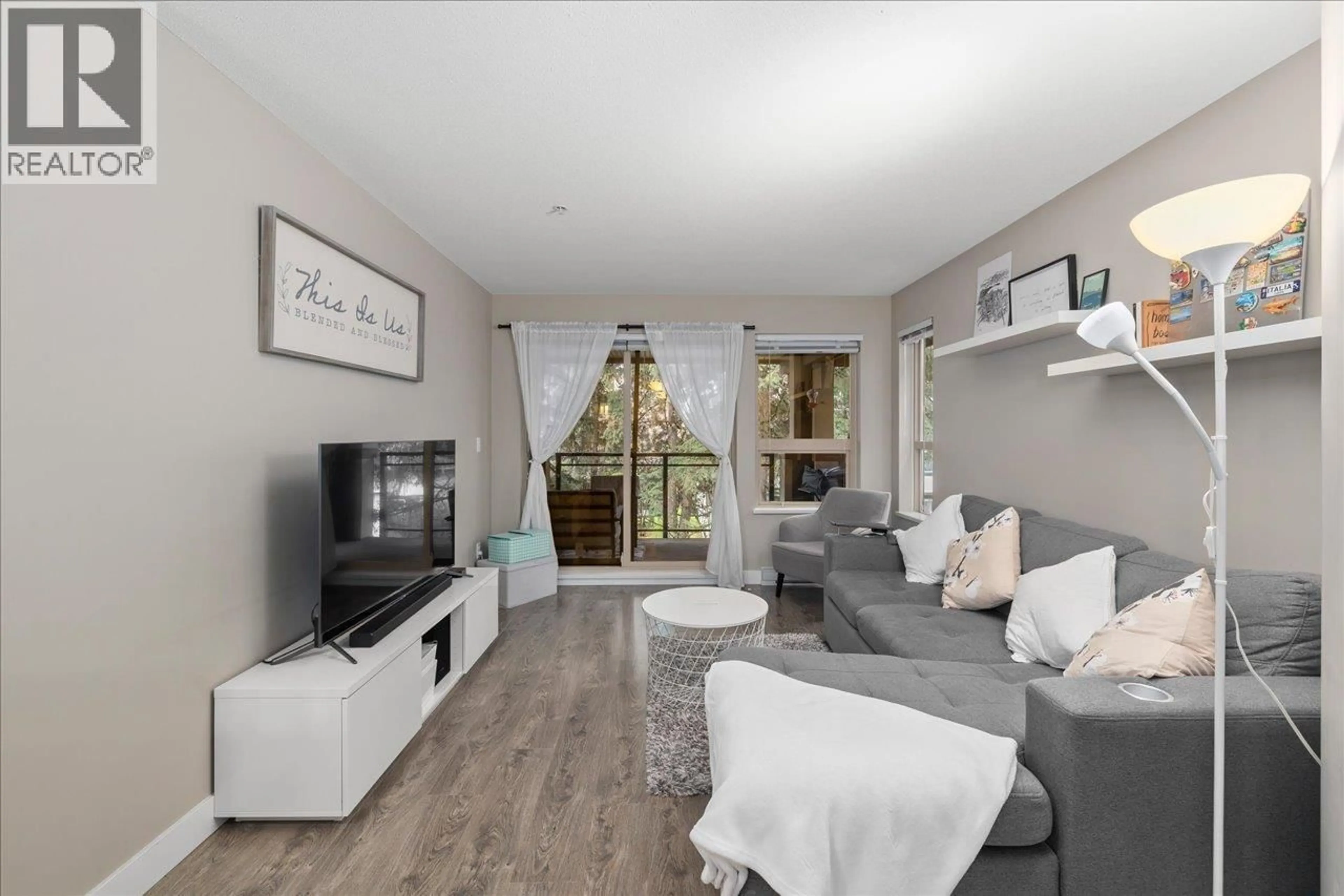 Living room with furniture, wood/laminate floor for 316 - 7131 STRIDE AVENUE, Burnaby British Columbia V3N0E3