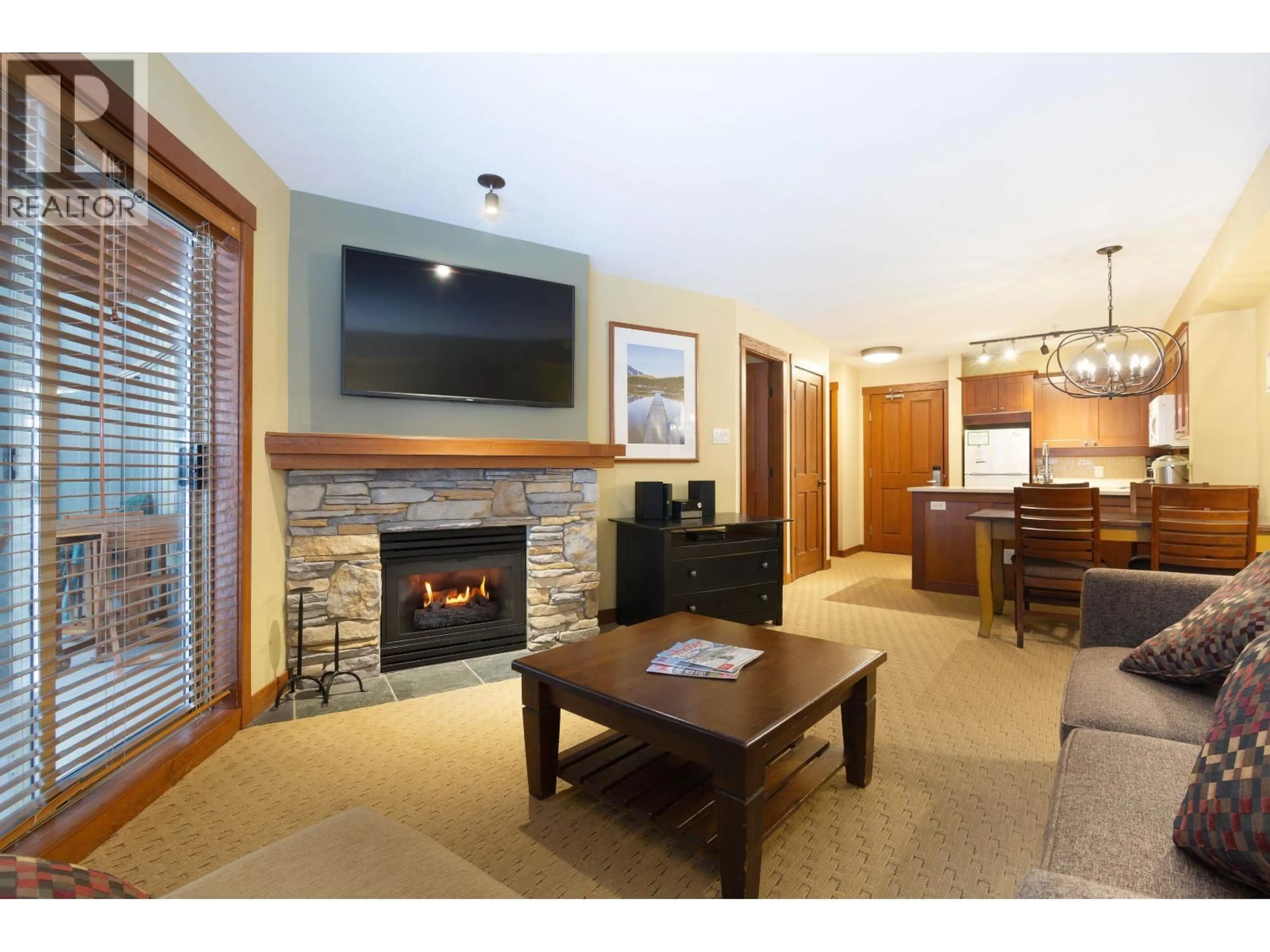 Living room with furniture, wood/laminate floor for 318 G1 - 4653 BLACKCOMB WAY, Whistler British Columbia V8E0Y9