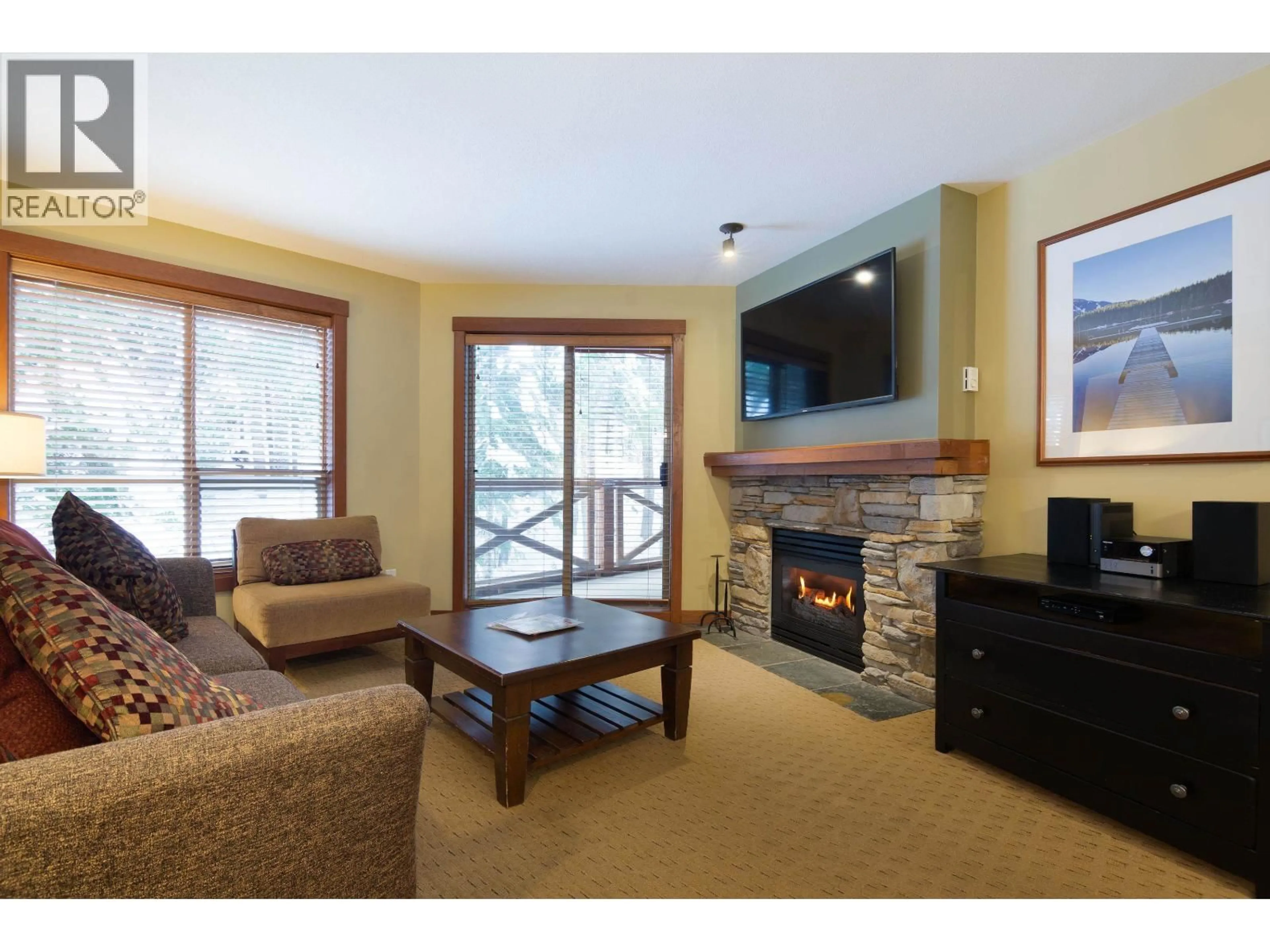 Living room with furniture, wood/laminate floor for 318 G1 - 4653 BLACKCOMB WAY, Whistler British Columbia V8E0Y9