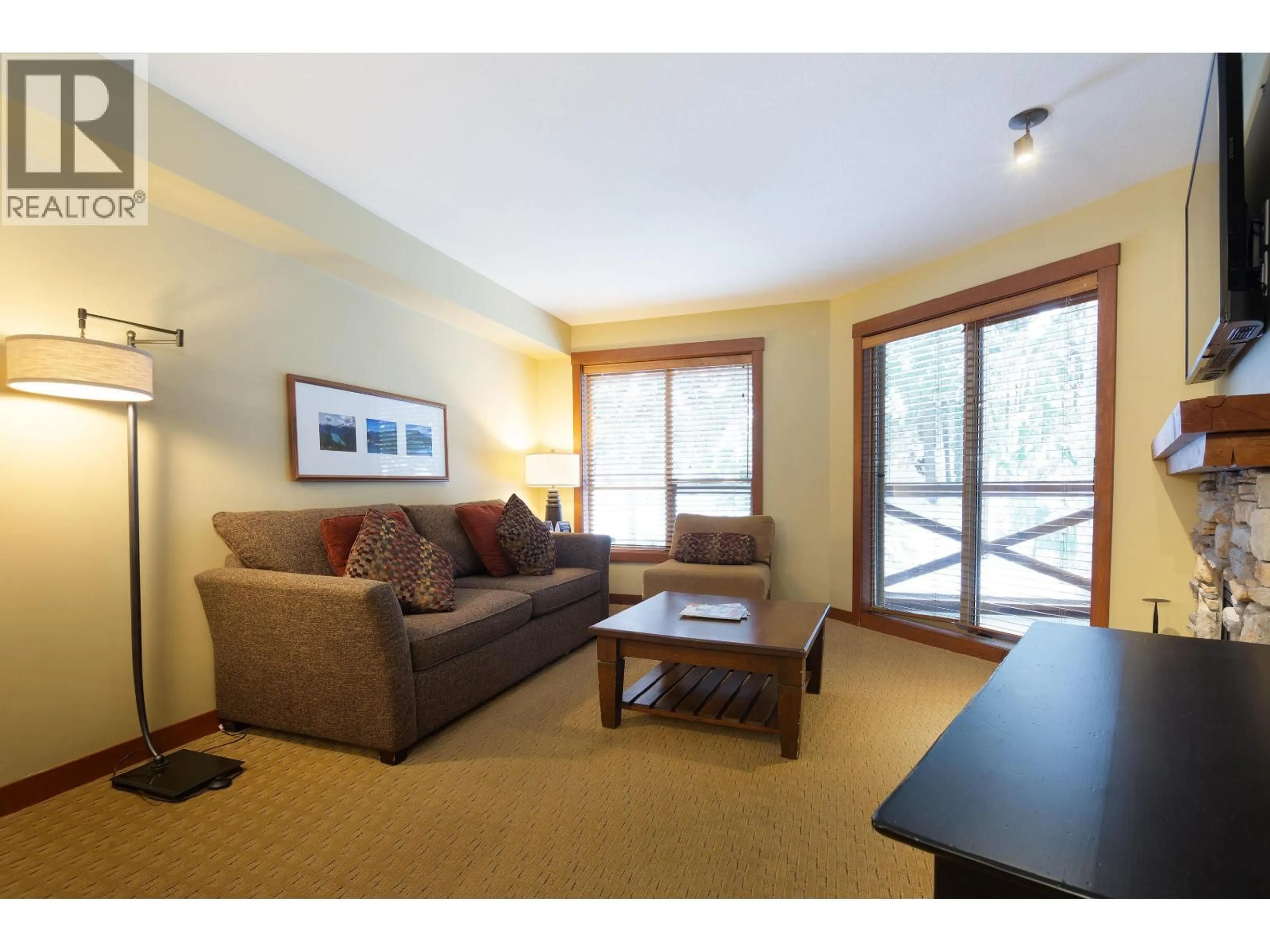 Living room with furniture, wood/laminate floor for 318 G1 - 4653 BLACKCOMB WAY, Whistler British Columbia V8E0Y9
