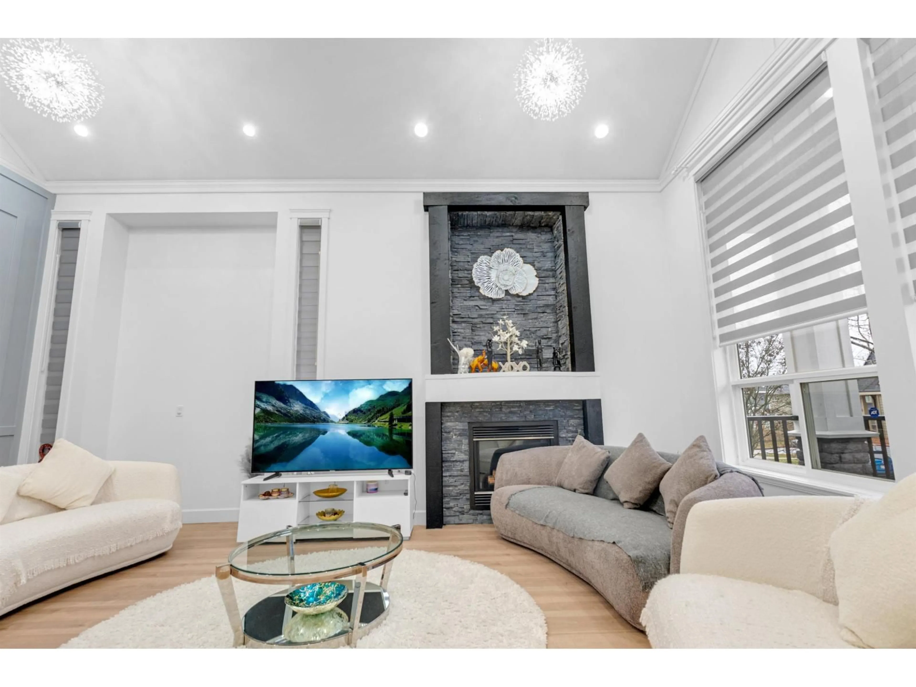 Living room with furniture, wood/laminate floor for 18358 67 AVENUE, Surrey British Columbia V3S1E5