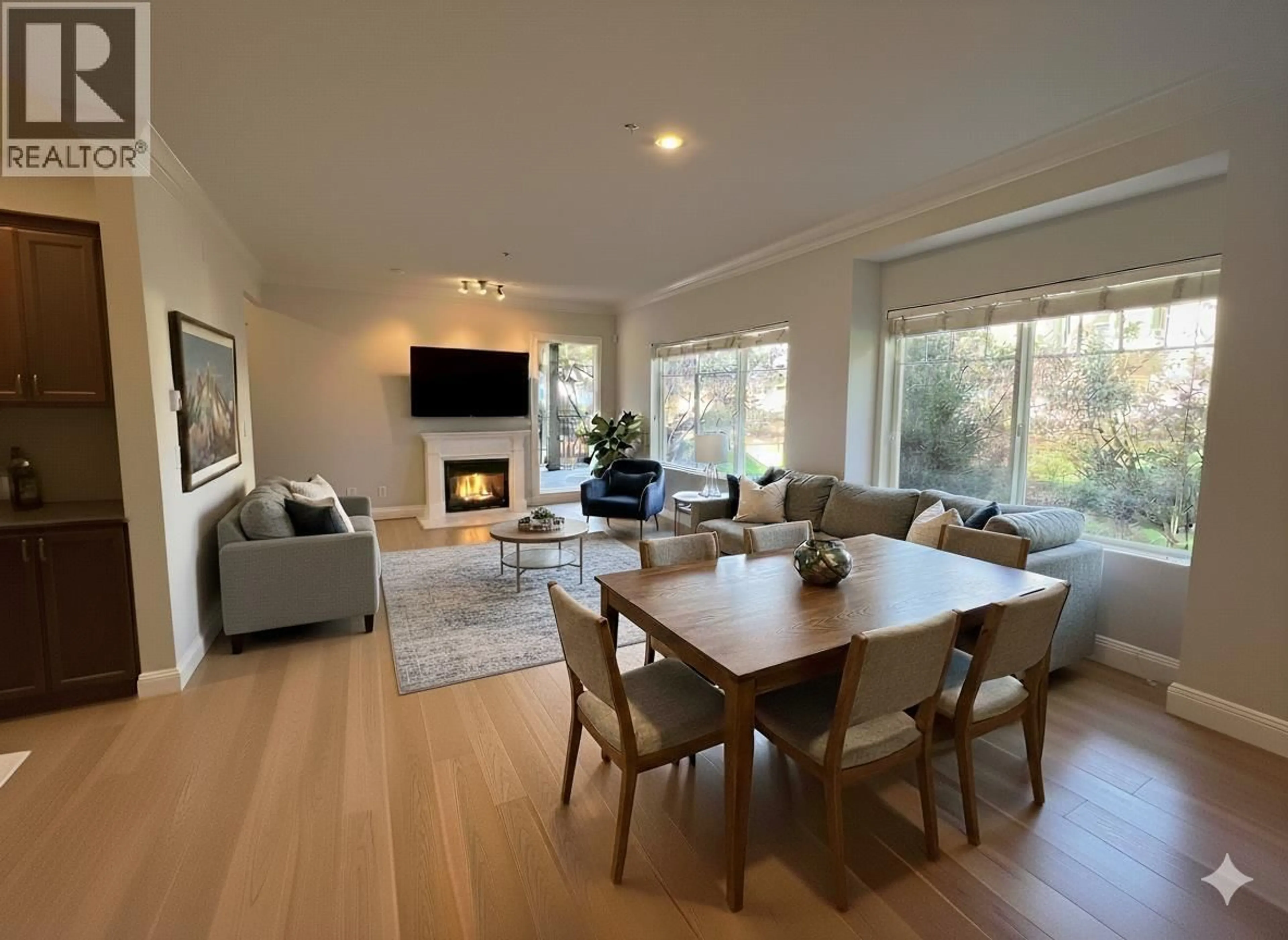 Living room with furniture, wood/laminate floor for 215 - 22150 DEWDNEY TRUNK ROAD, Maple Ridge British Columbia V2X3H6