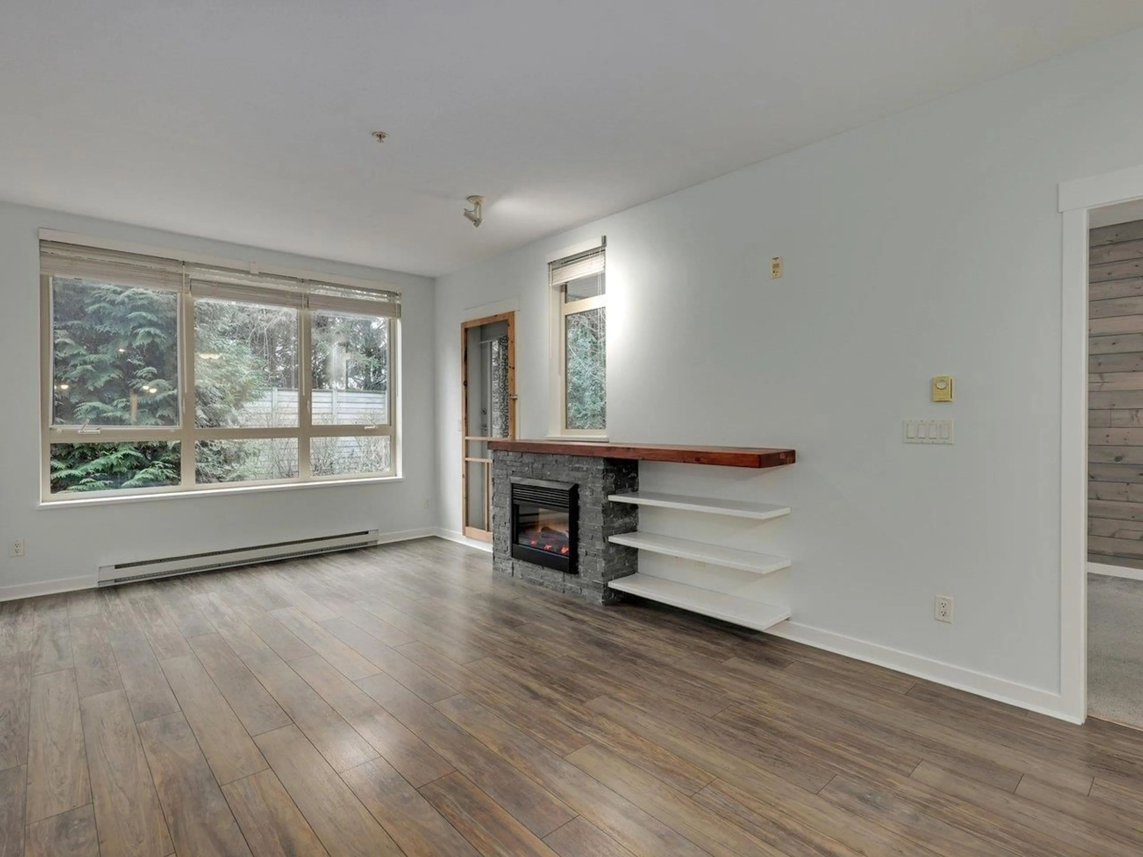 Living room with furniture, wood/laminate floor for 224 - 15918 26 AVENUE, Surrey British Columbia V3S5K3